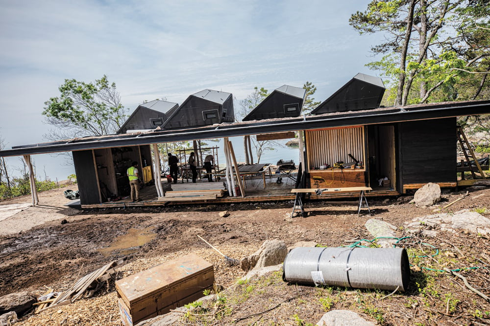 a photograph of a science research facility under construction on horse island designed and built by students at the Yale school of architecture