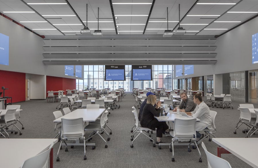 An interior image of a large open meeting area in an educational building