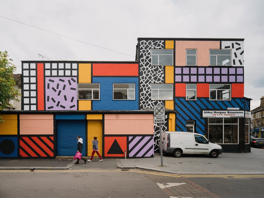 camille walala transforms london's white city place with colorful geometric  patterns