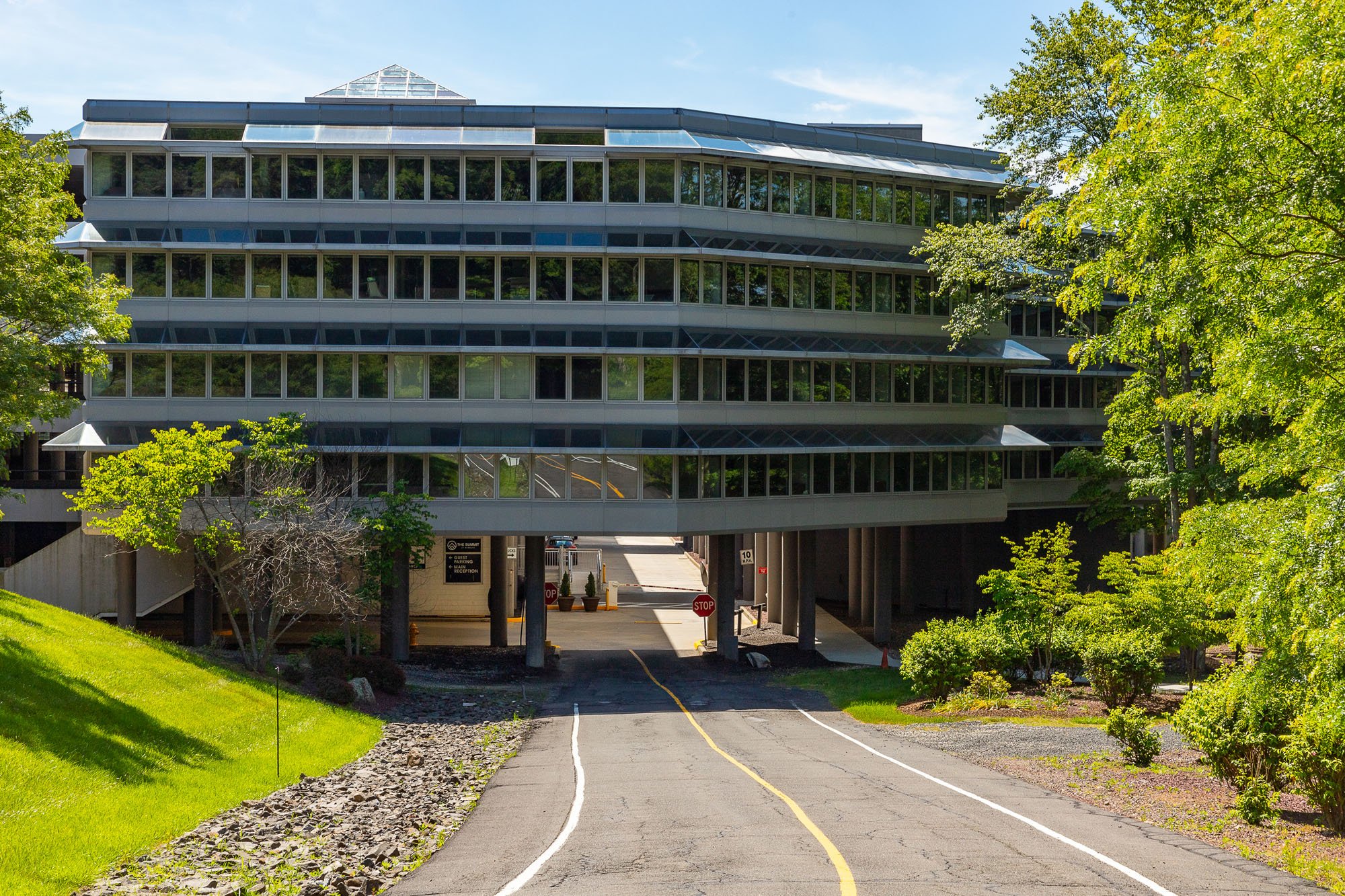 Photograph shows the view of an entrance to an interior parking facility