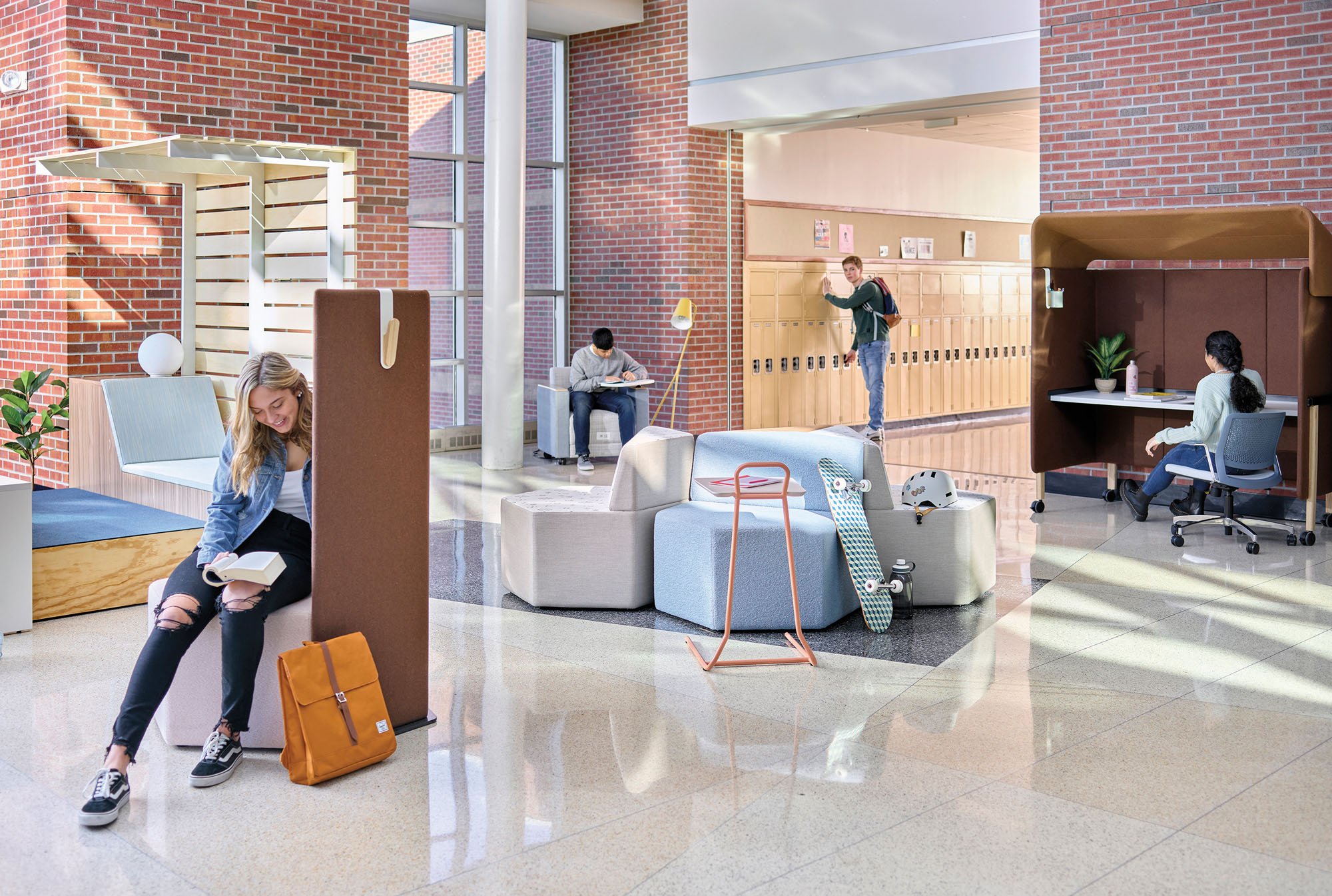 A school interior showing students using mobile furniture