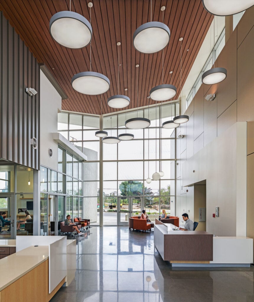 Community Center entrance interior, with high ceilings and chandeliers. 