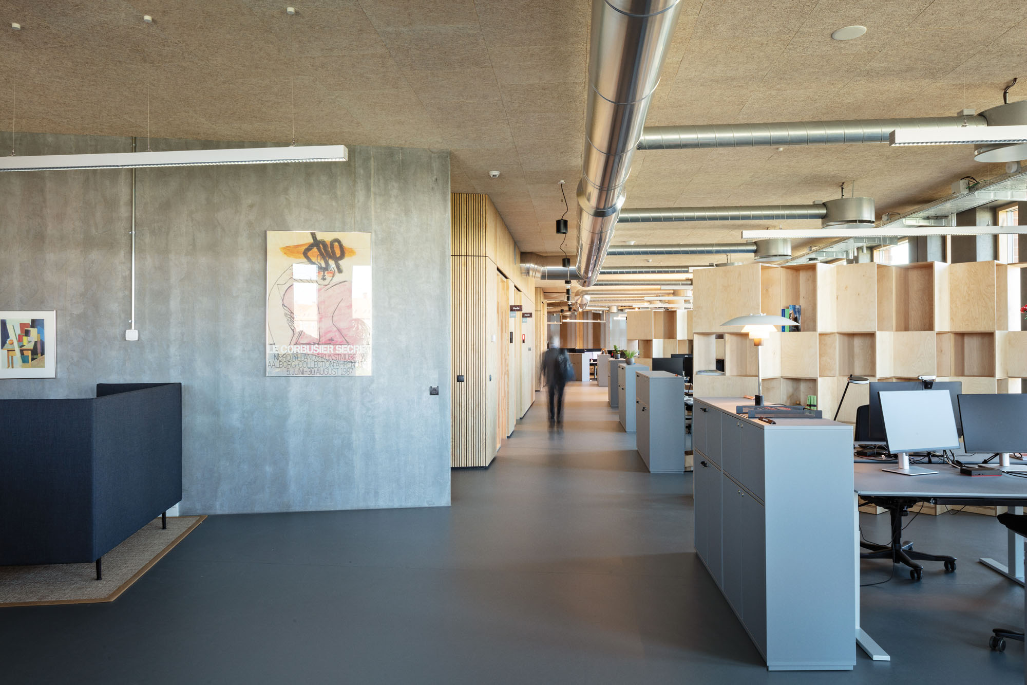 open plan work area set off by wooden screens