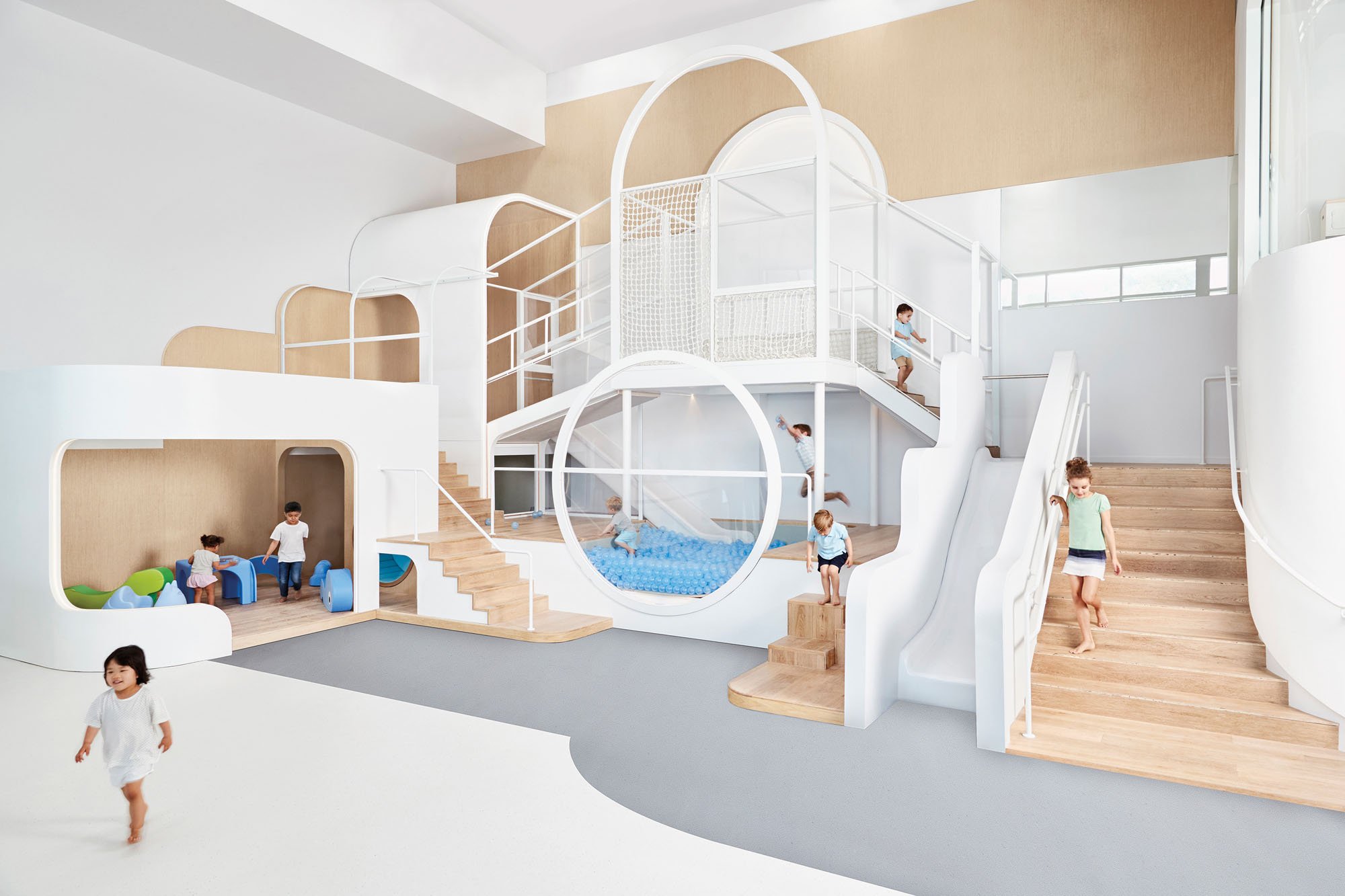 kids playing in white and birch colored playscape