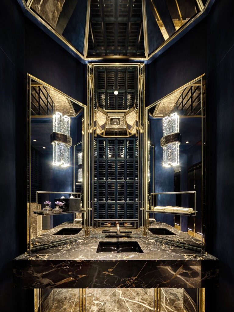 Bathroom interior with gilded mirror