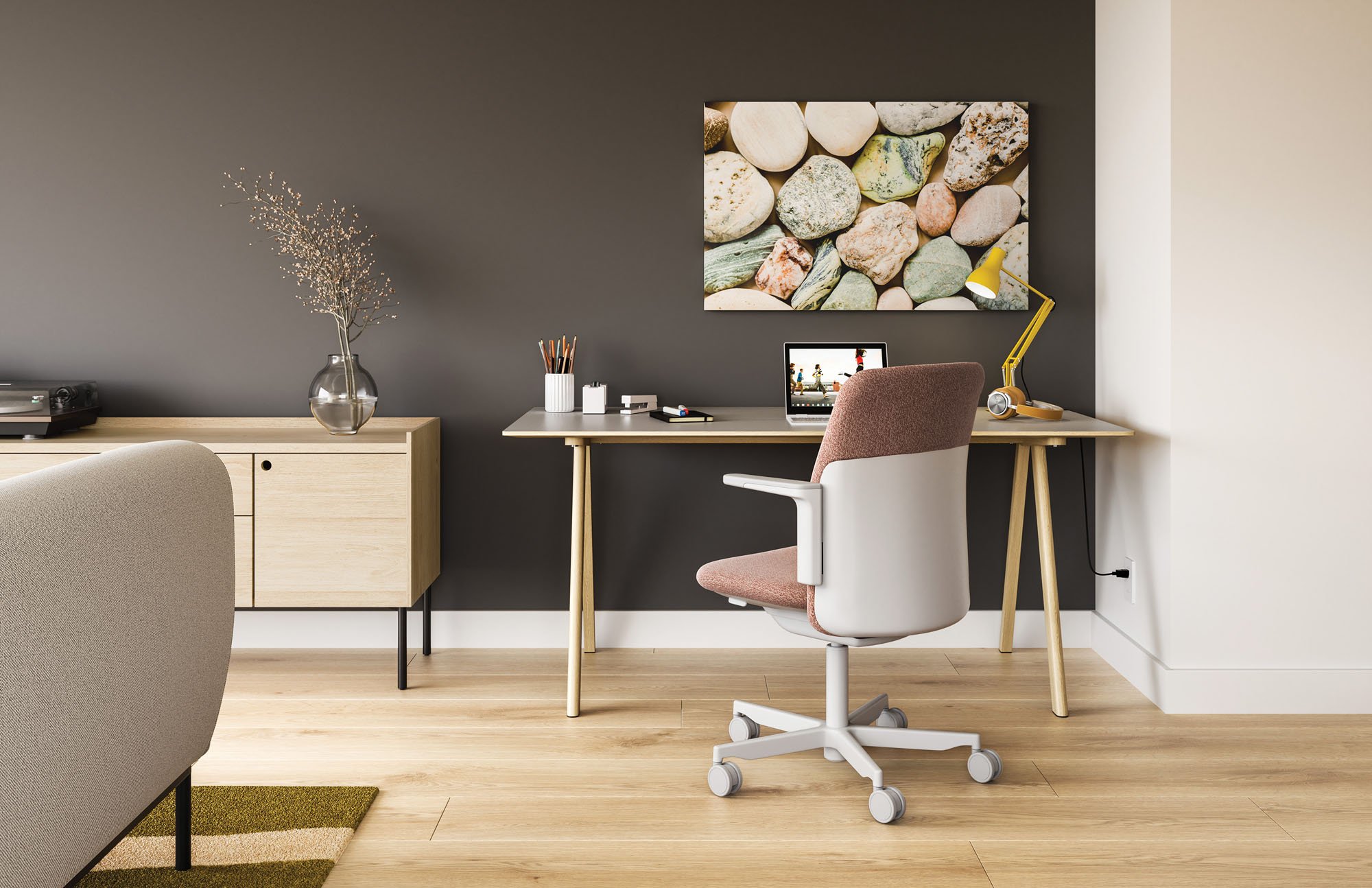 a photograph of a humanscale office chair in a home office