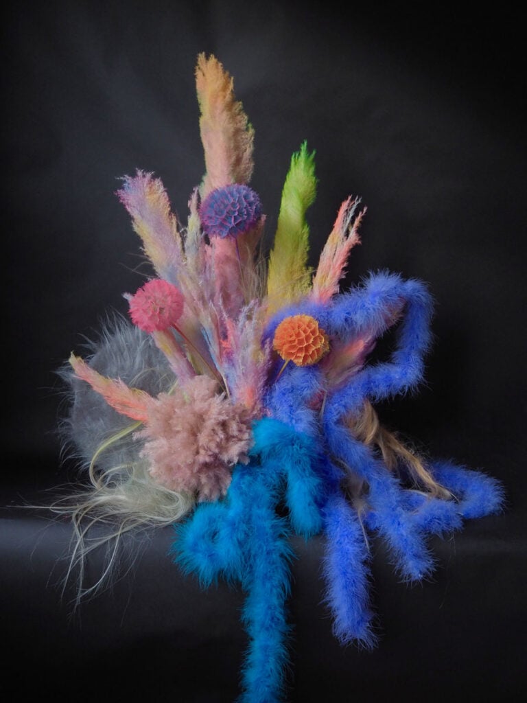 image of a floral arrangement against a black backdrop