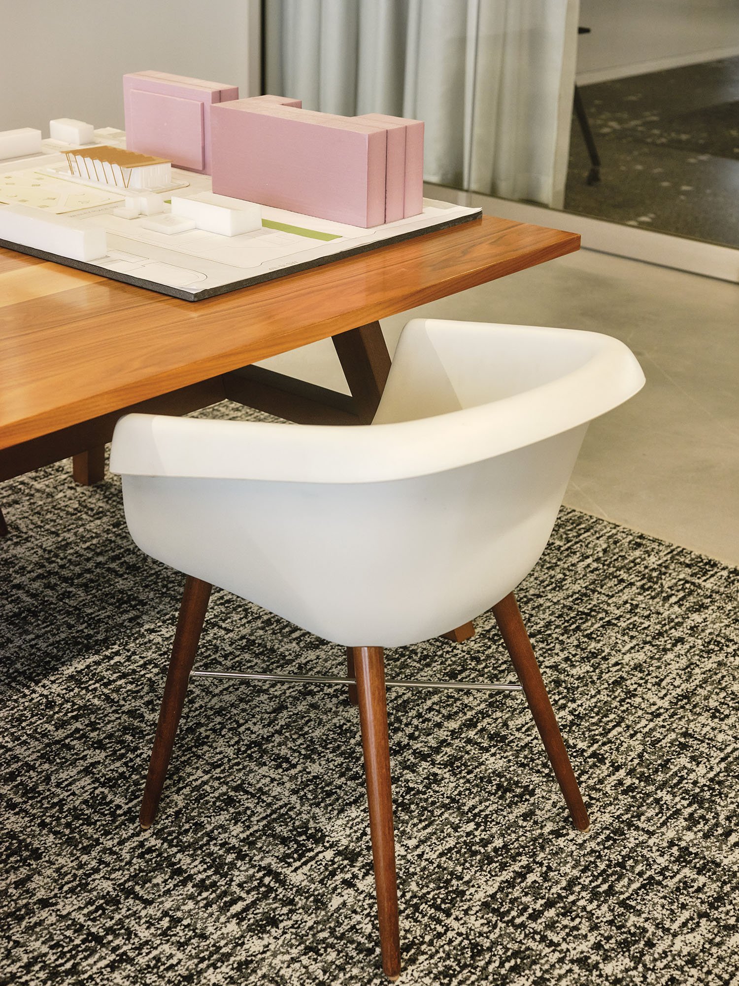 office interior showing white chair and wooden table