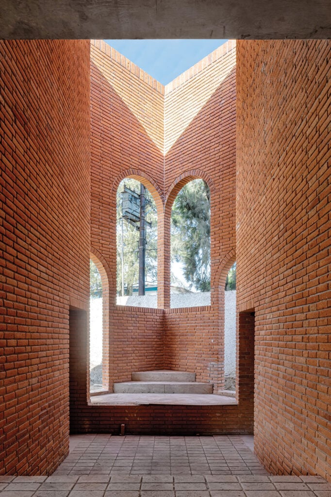 a photograph of the interior brick building with arched windows