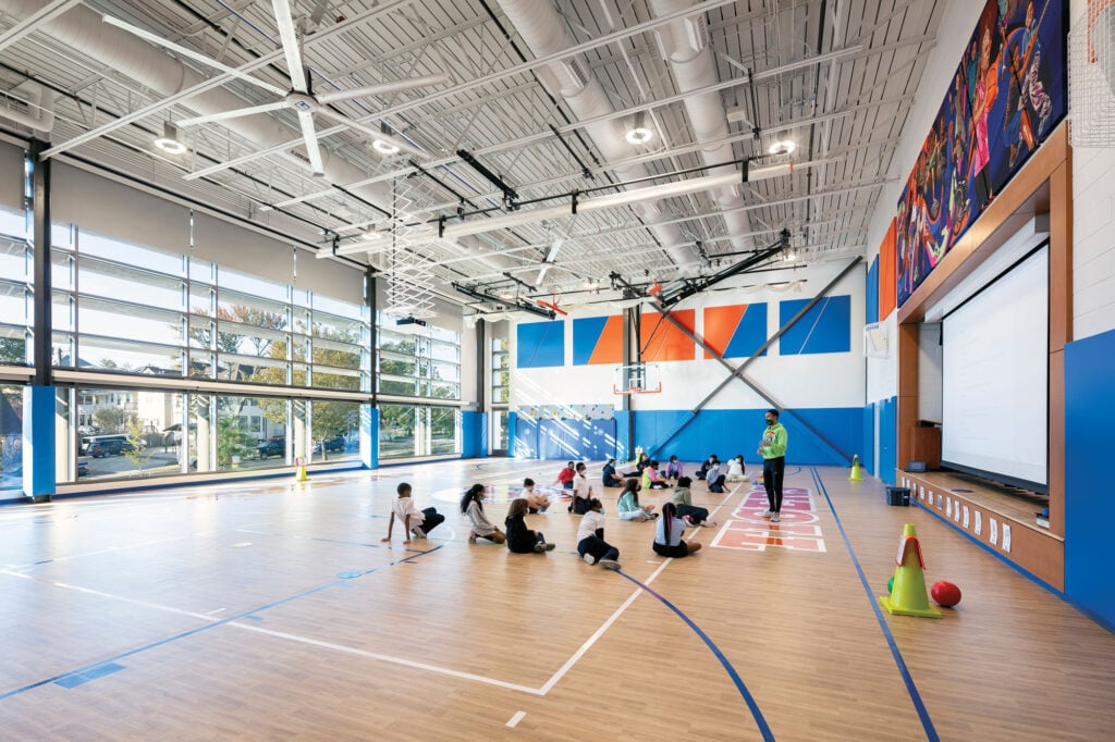 interior of gymnasium with large windows