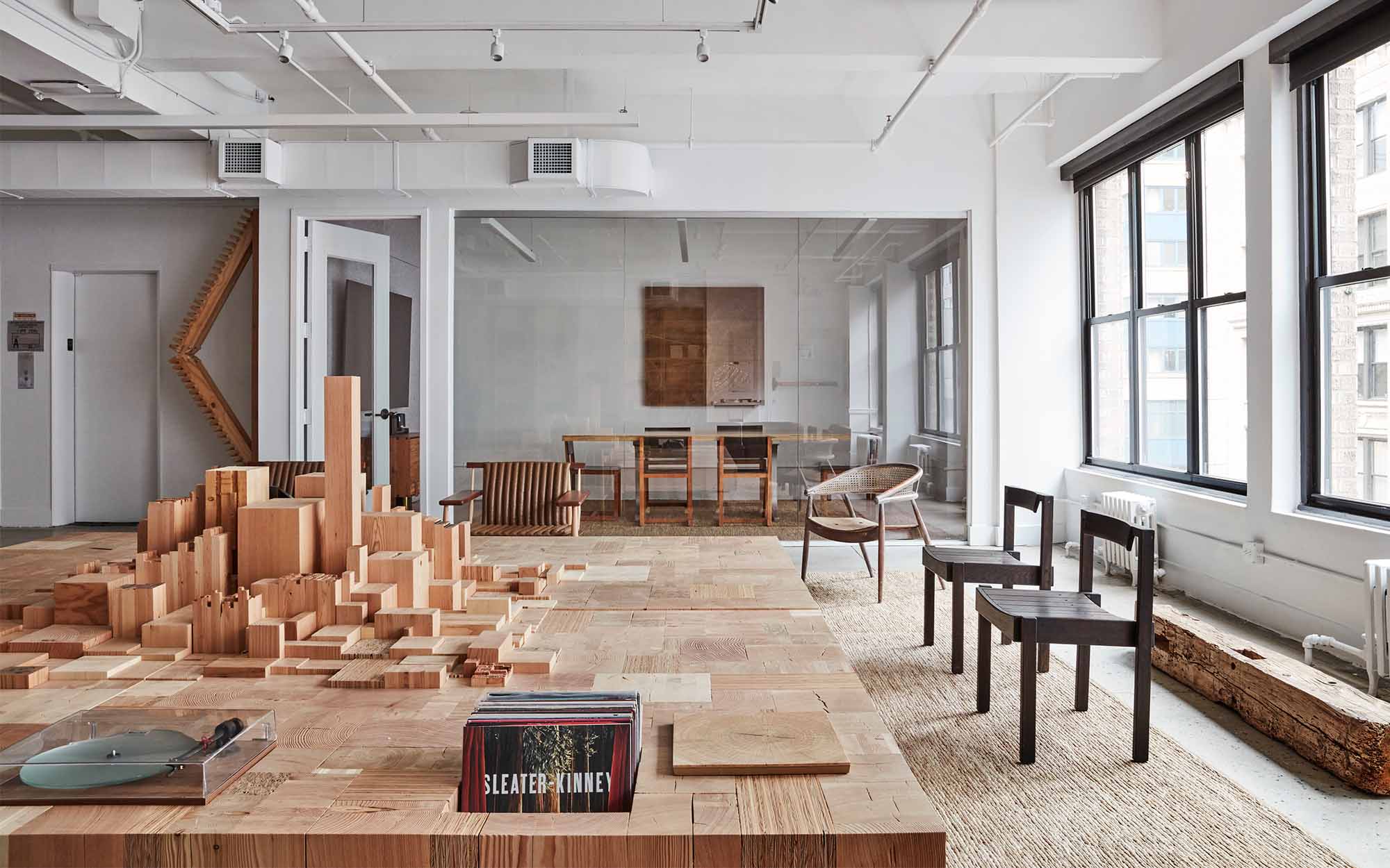 Olson Kundig designs own office interior with cityscape timber table