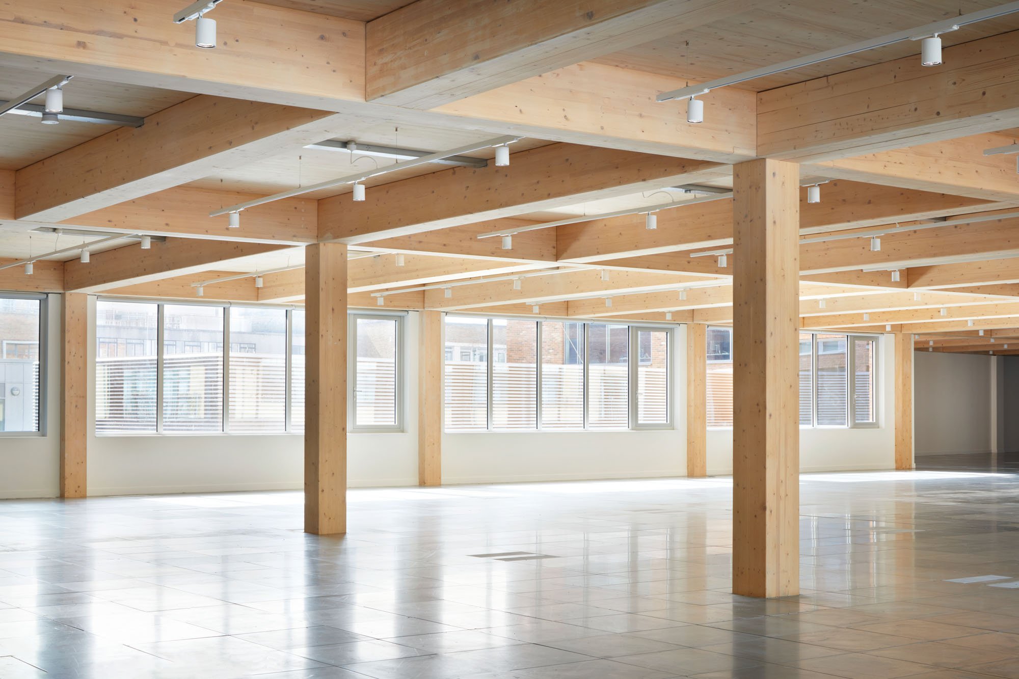 empty interior with clt columns and polished floors