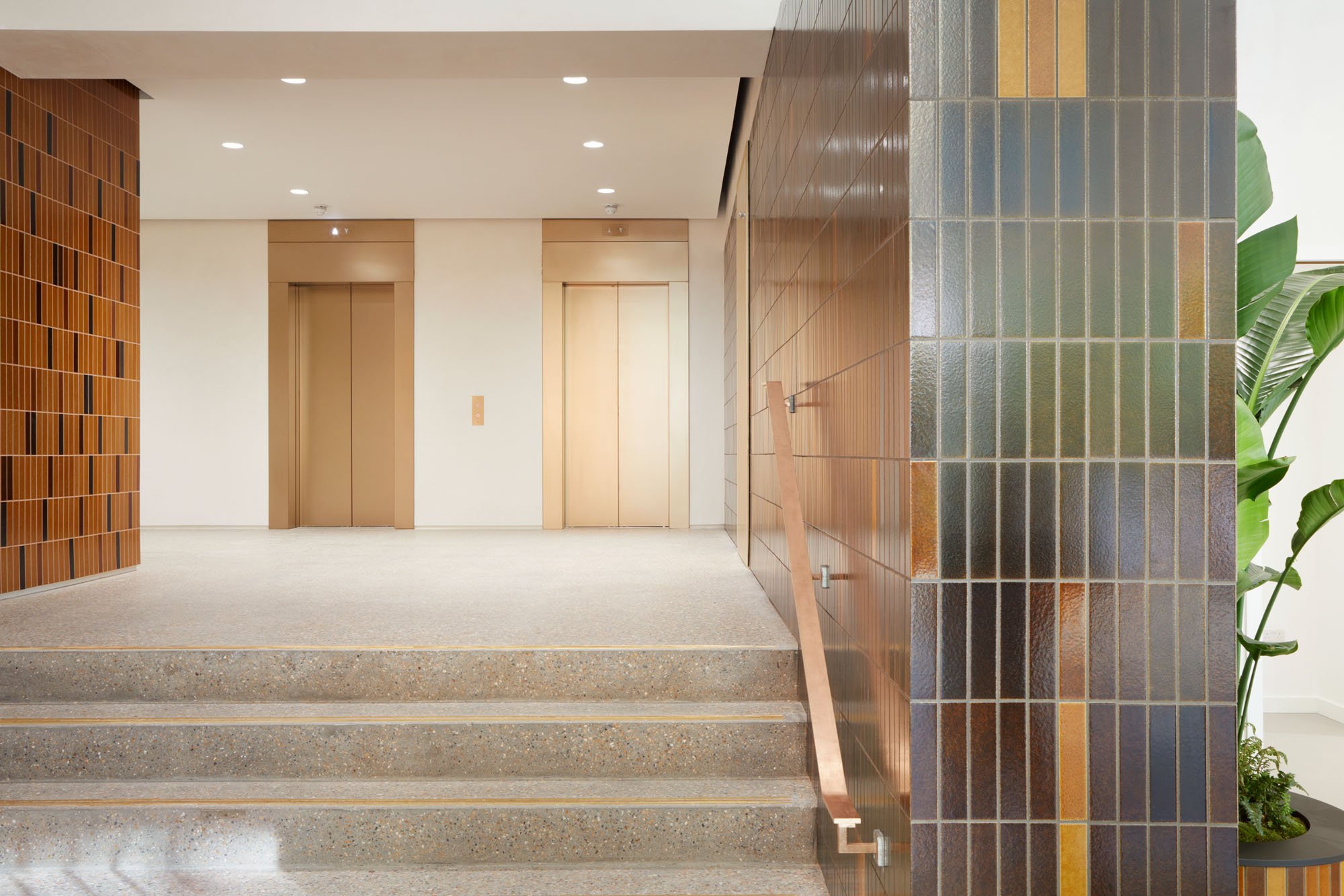 tiled walls by stairway and elevators