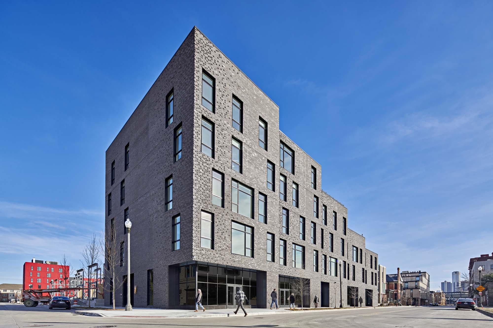 exterior of a gray Masonry building with a textured facade