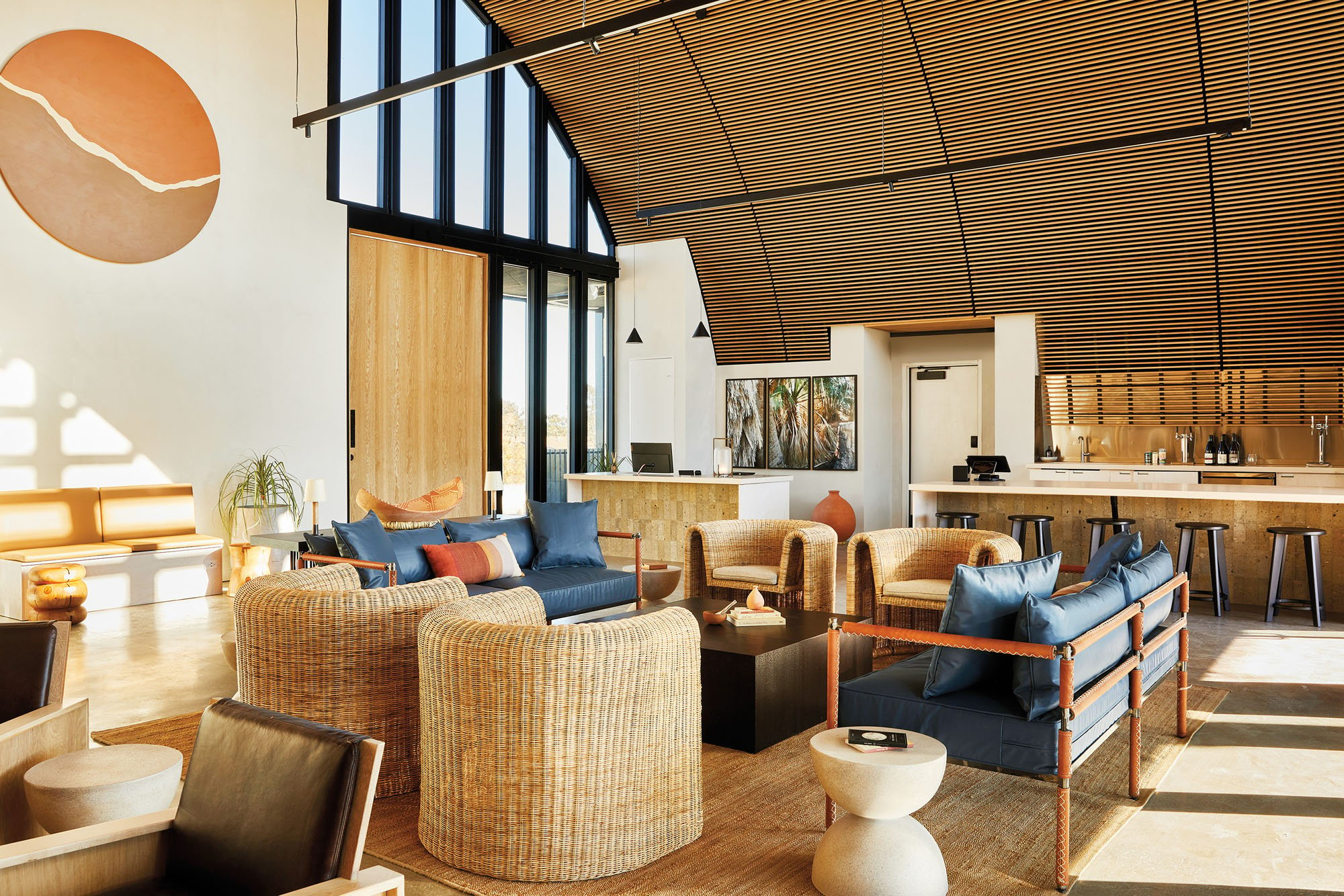 interior of the clubhouse with a bar  visible behind and chairs in front