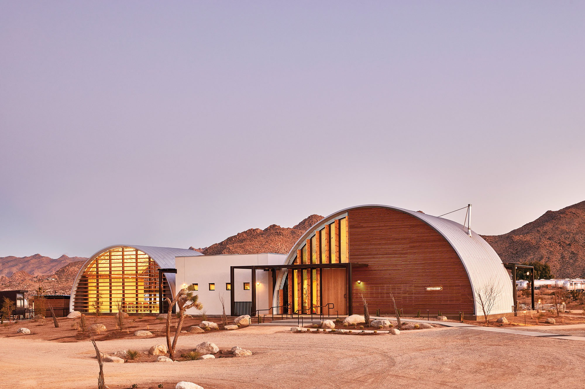 two quonset huts converted to hotel buildings