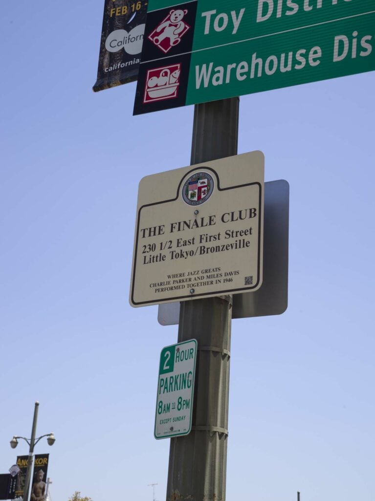 two signs on a street lamppost in Los angeles.