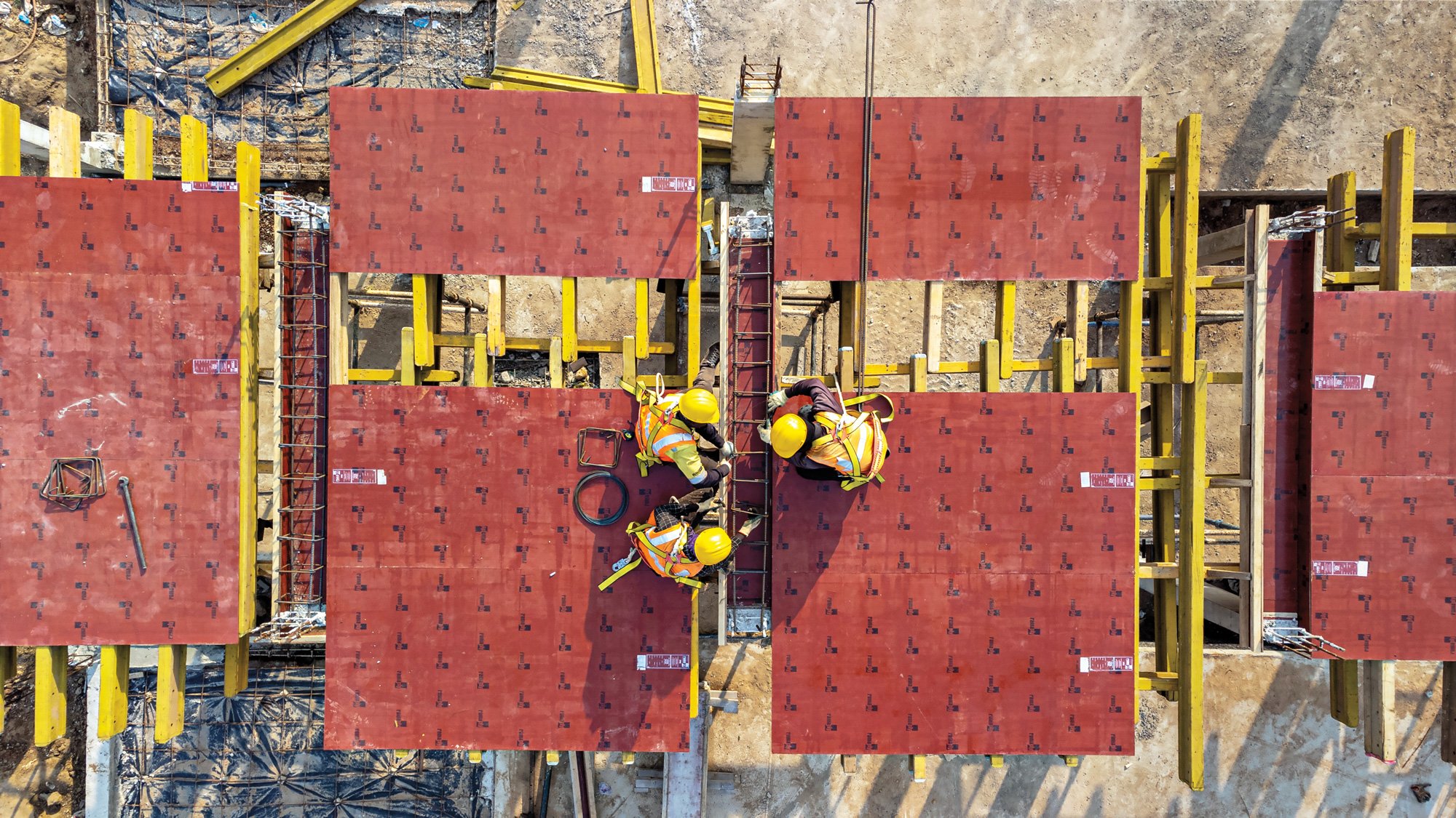 workers on top of construction site