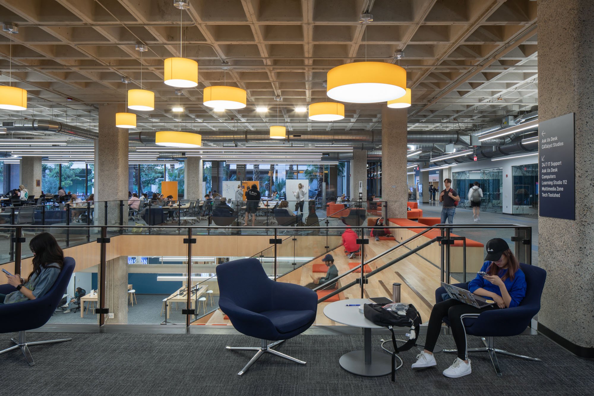 students gathered inside university of arizona library student success district