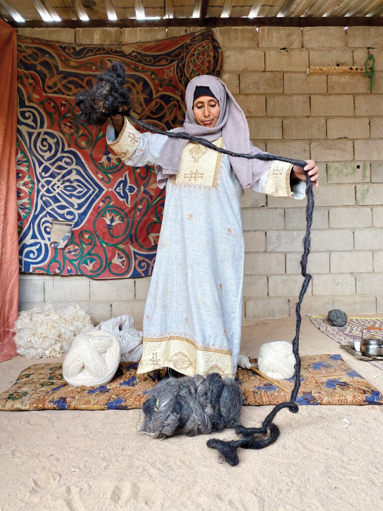 Image of a woman holding fibers