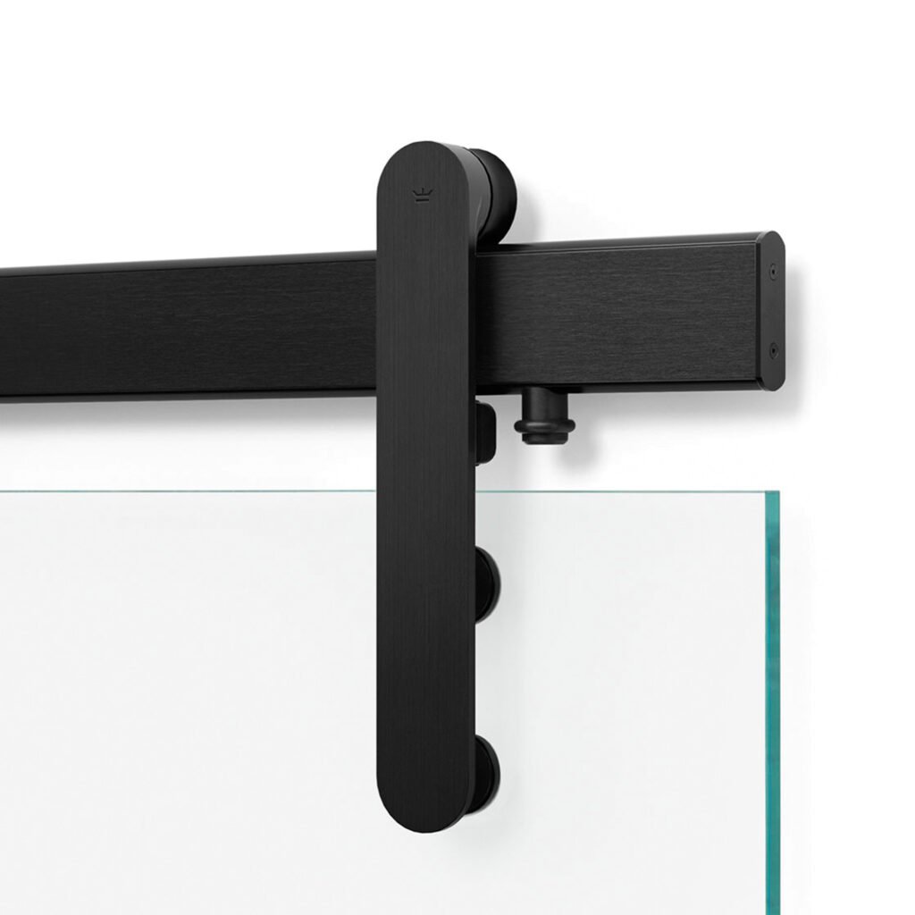A barn door system in powder coated black and glass with hidden joinery