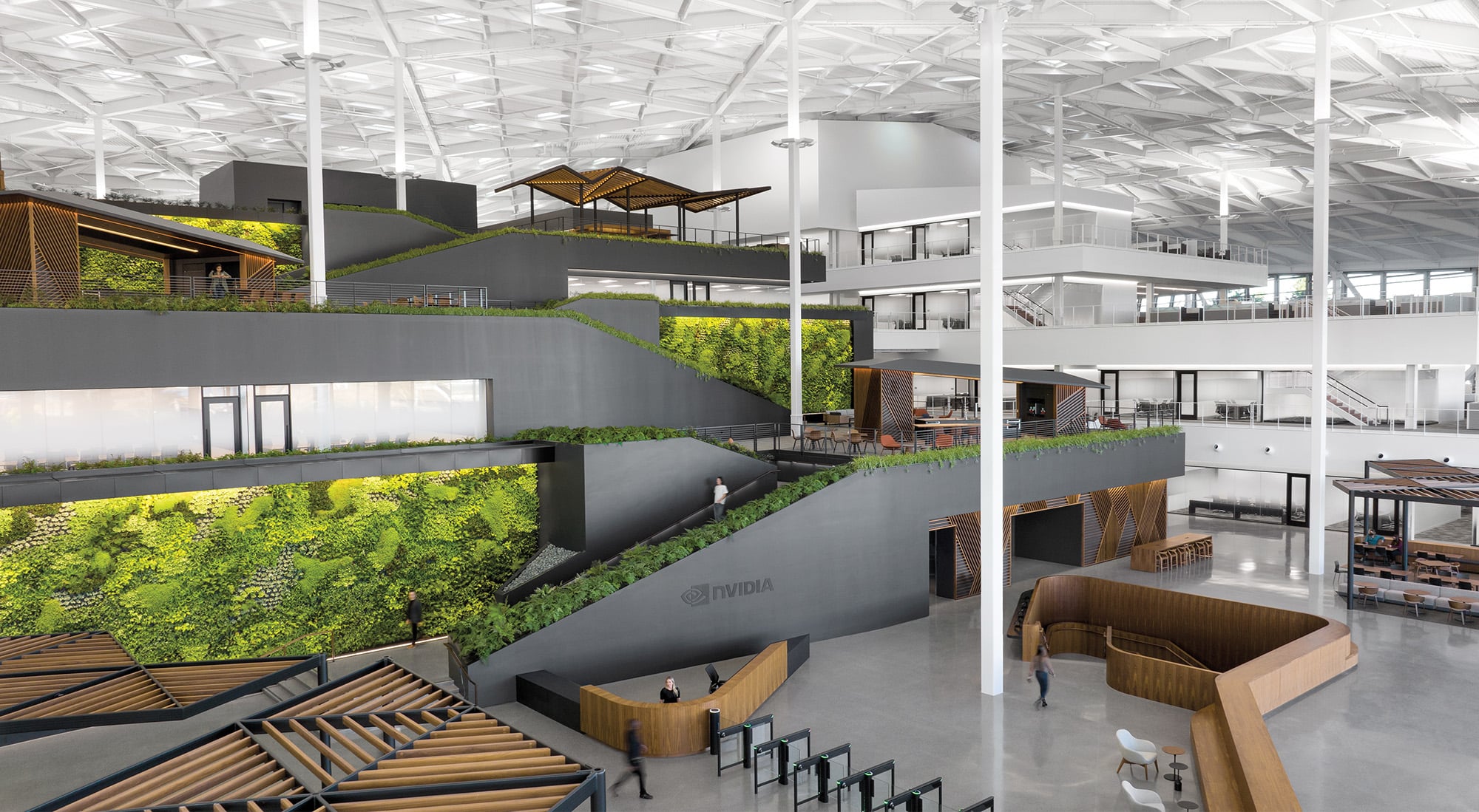 Interior renders of the NVIDIA campus with large double height strcutures filled with garden walls and open layouts held together and covered with thin white beams that hold the massive steel roof structure. 