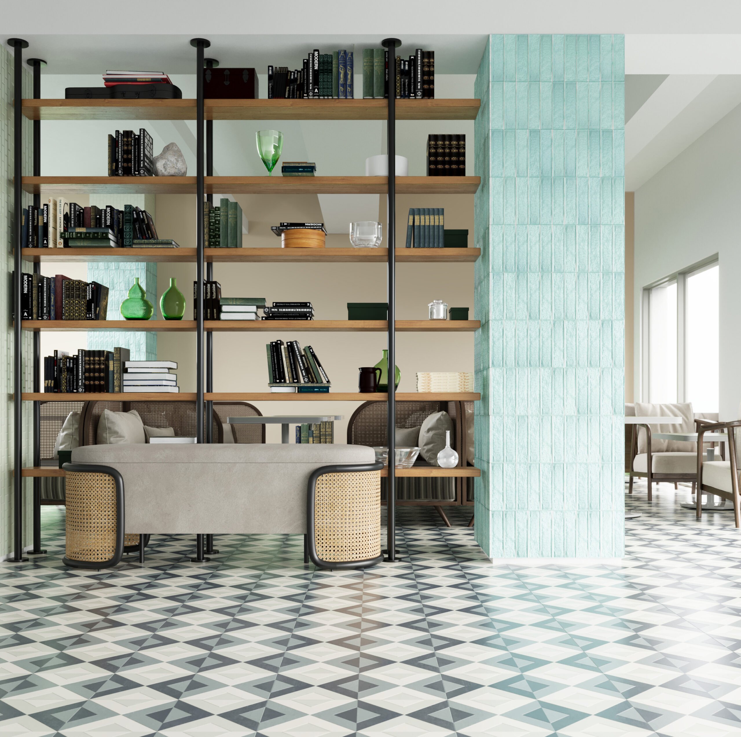A space divided with a turquoise wallpapered pillar and a bookshelf along with floor lined with a mozaic mint and grey flooring.