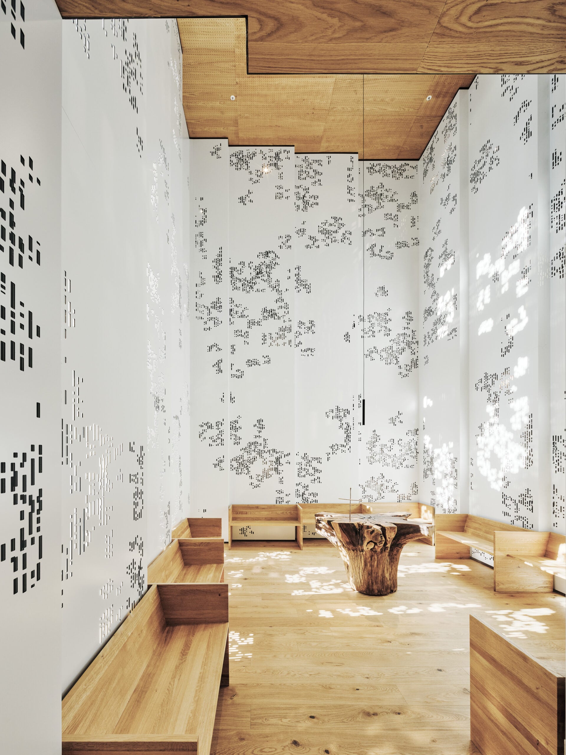 The 'Space of Light' Fractal Chapel at University Hospital Graz, featuring white walls with computer-generated fractal patterns that filter light to reduce occupant stress