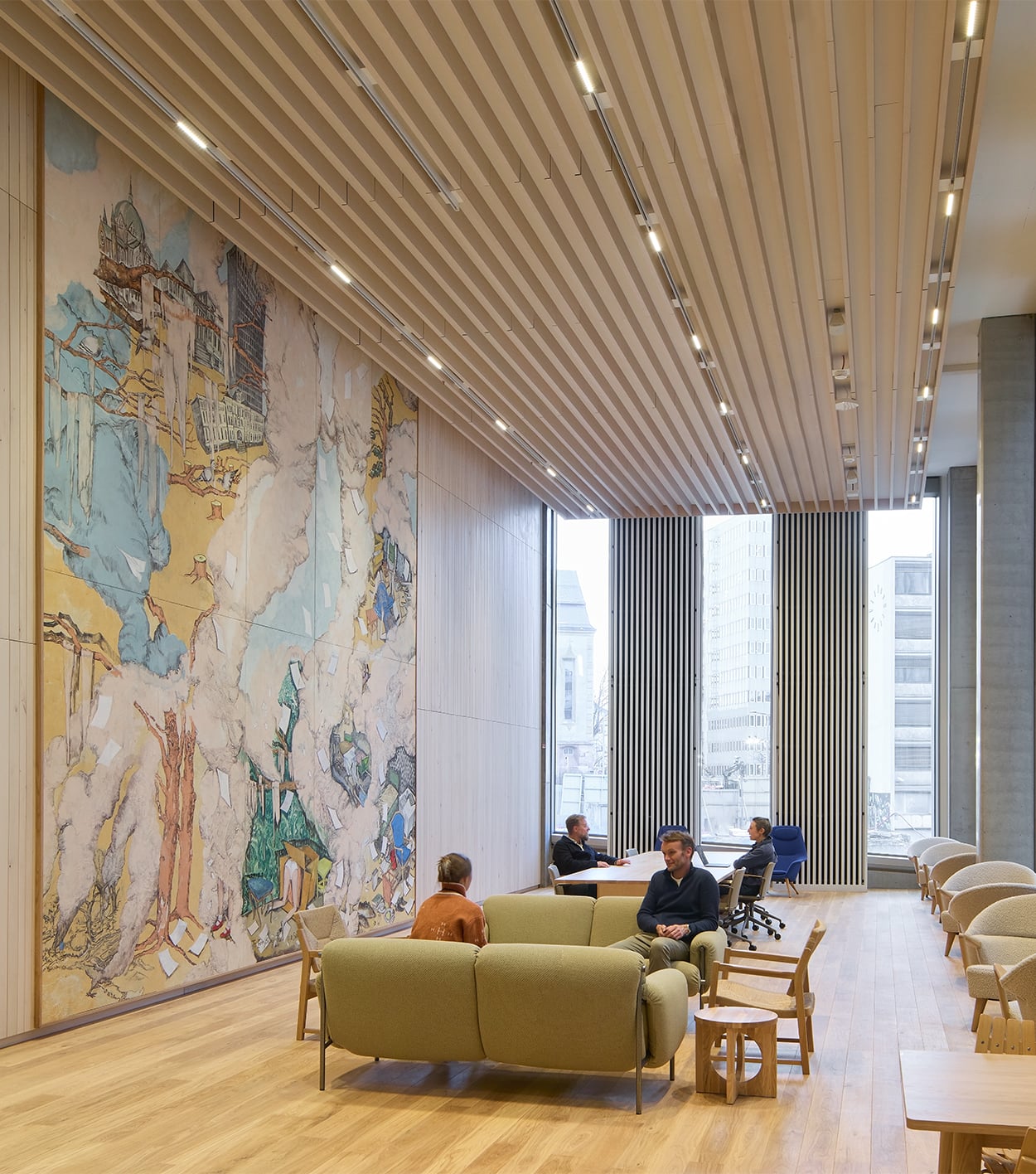 interior of a government building in norway with seating and views out the window