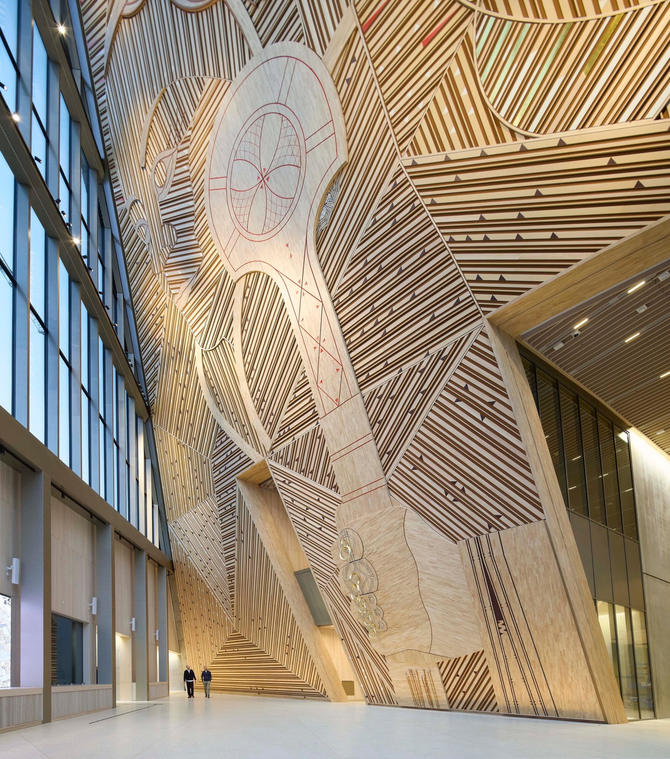 interior of a government building in norway with a large wood wall design