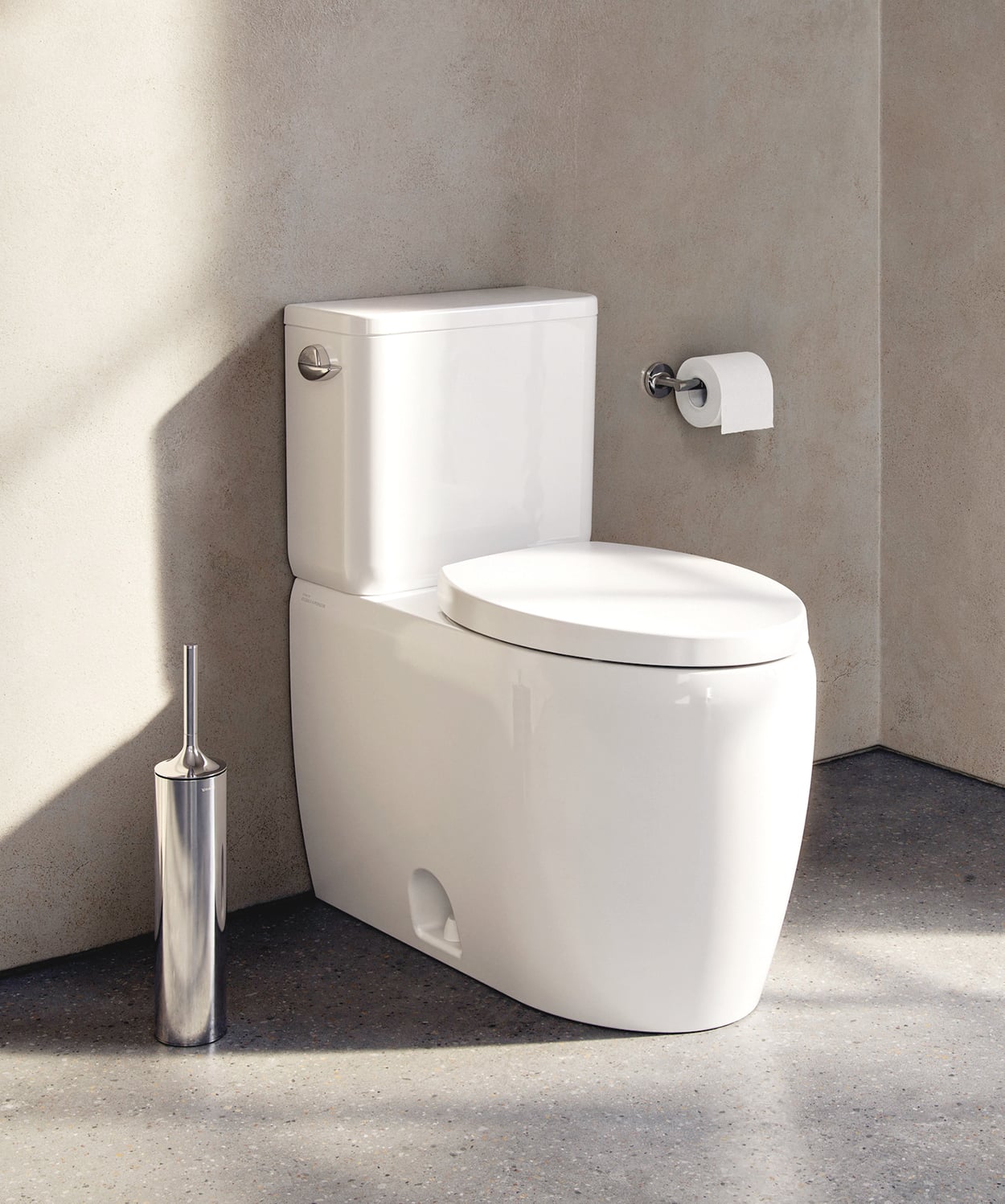 Qatego Two-Piece Toilet by Duravit: modern, white toilet on concrete floor with beige wall behind
