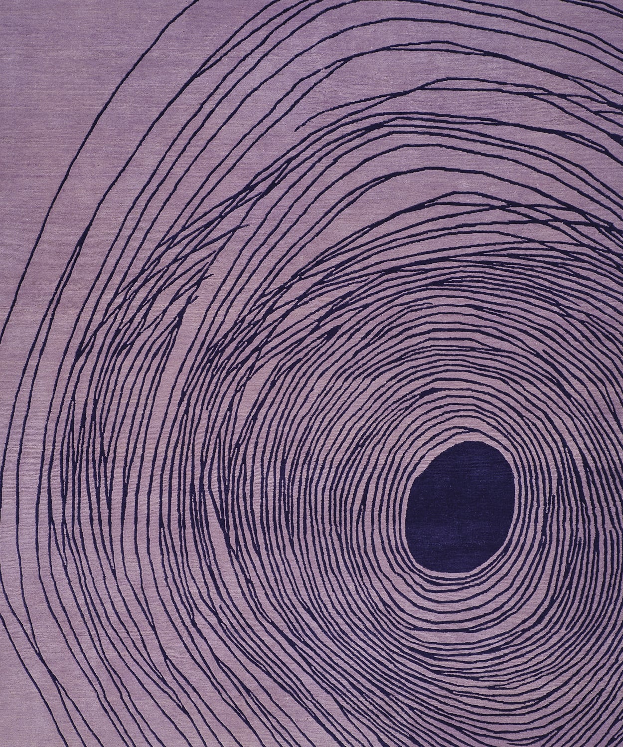 Abstract design showing concentric, irregular black rings radiating from a central black circle on a purple background.