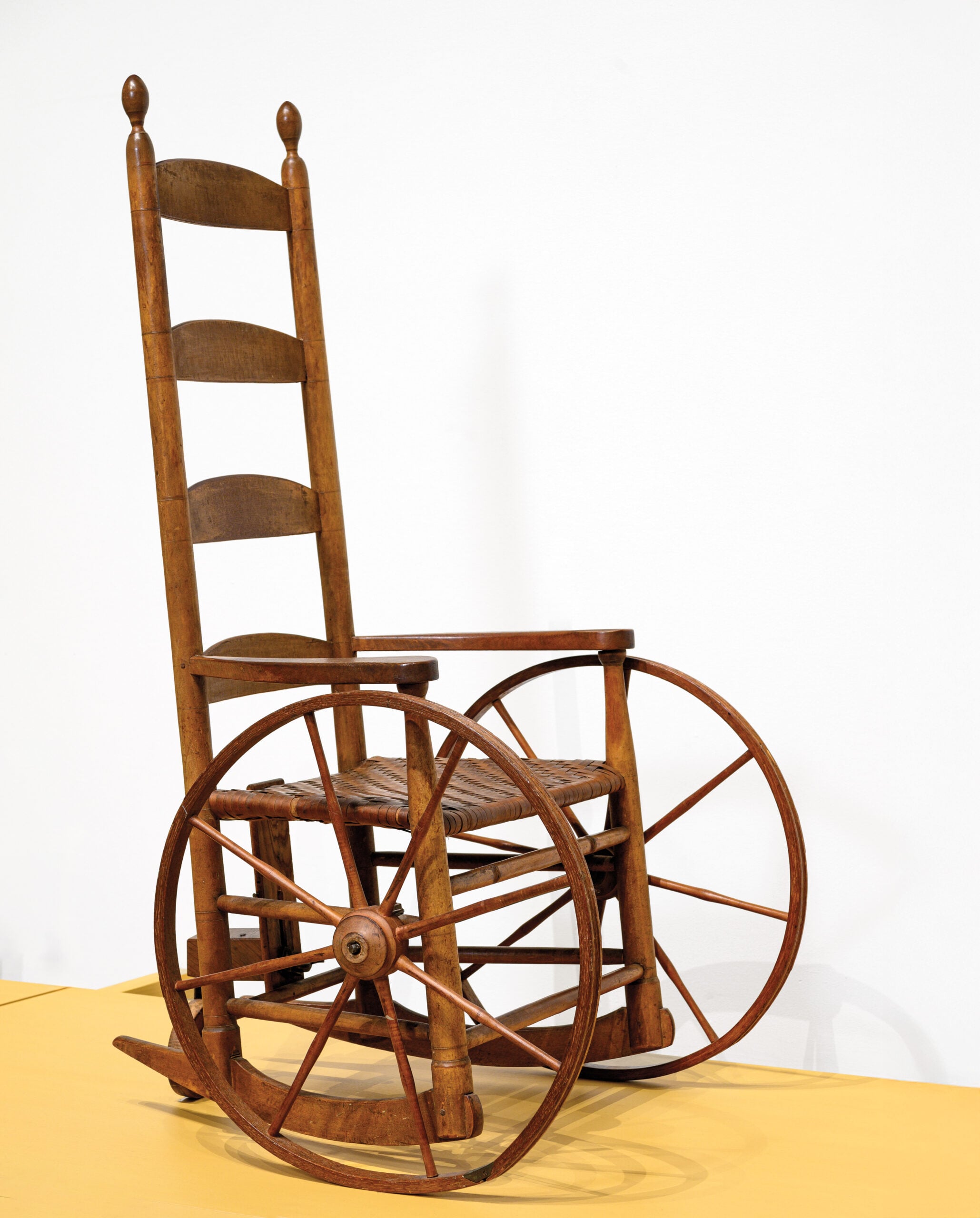 Wooden wheelchair made from a Shaker rocking chair