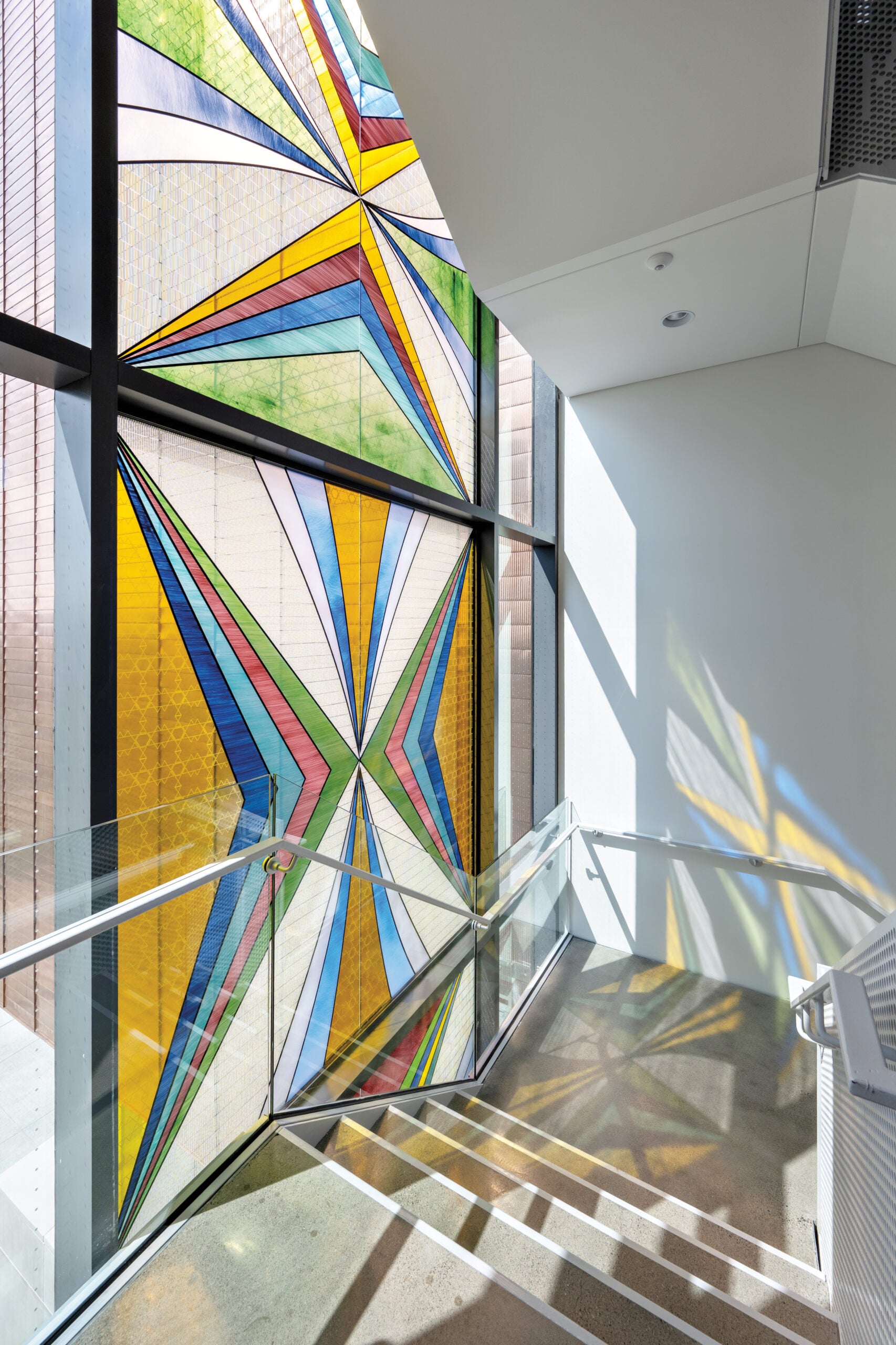 Colorful glass mosiac facade with Lakota designs in staircase