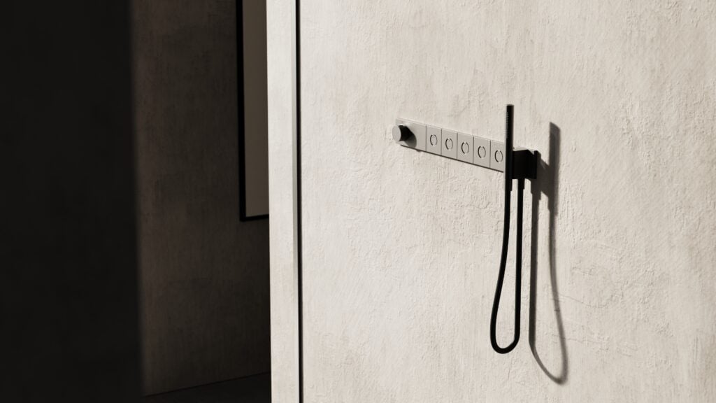 GROHE Rain shower Aqua Tiles and GROHE Groh Therm Aqua Tiles – A modular, flush-mounted shower system designed for customizable shower environments with multiple spray options and a magnetic hand shower. Courtesy GROHE