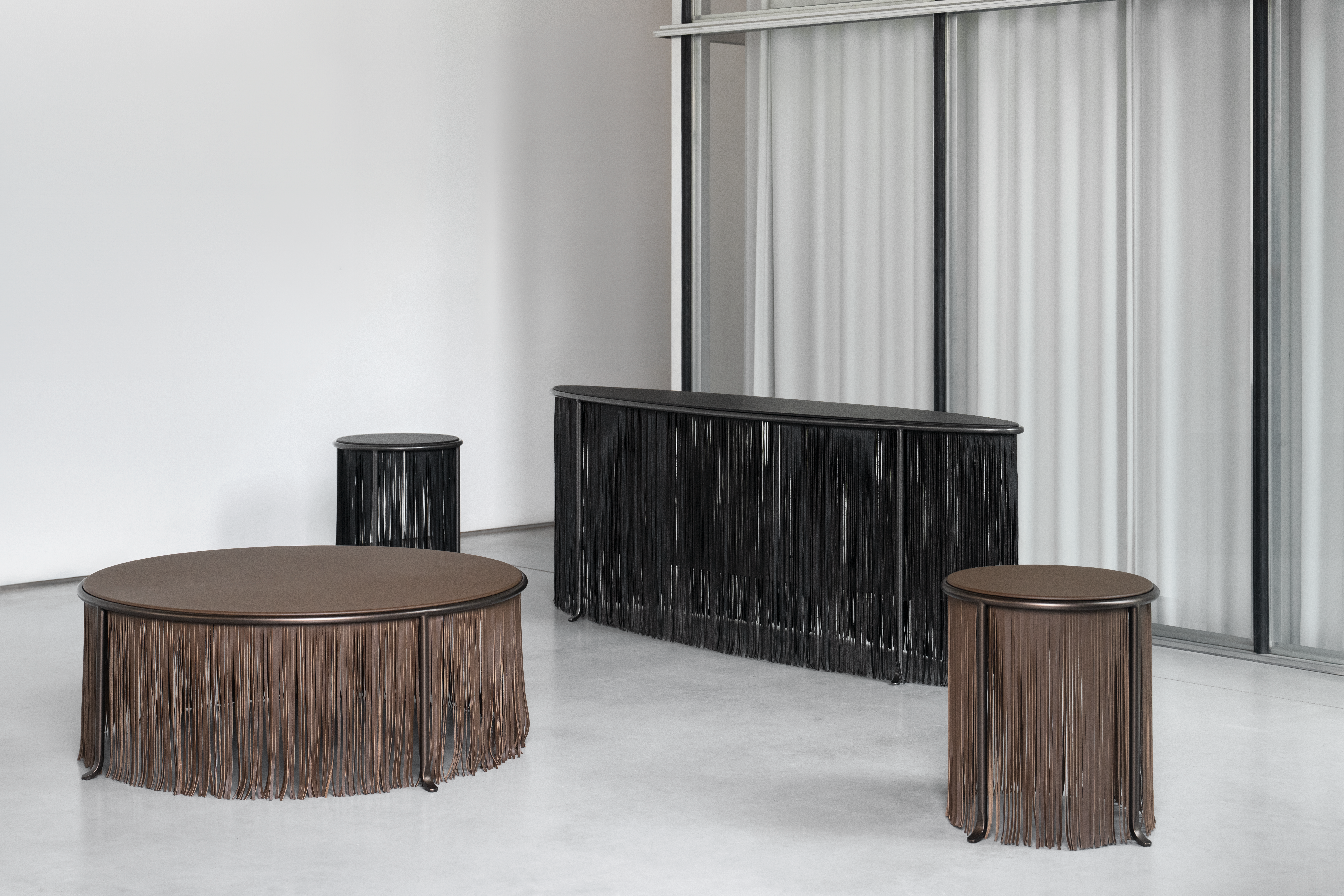 The Dozie Kanu Table Collection produced by Knoll. Designed by the Nigerian-American Dozie Kanu, the pieces are inspired by African symbology and Texan leather works. Courtesy of the Artist / Knoll