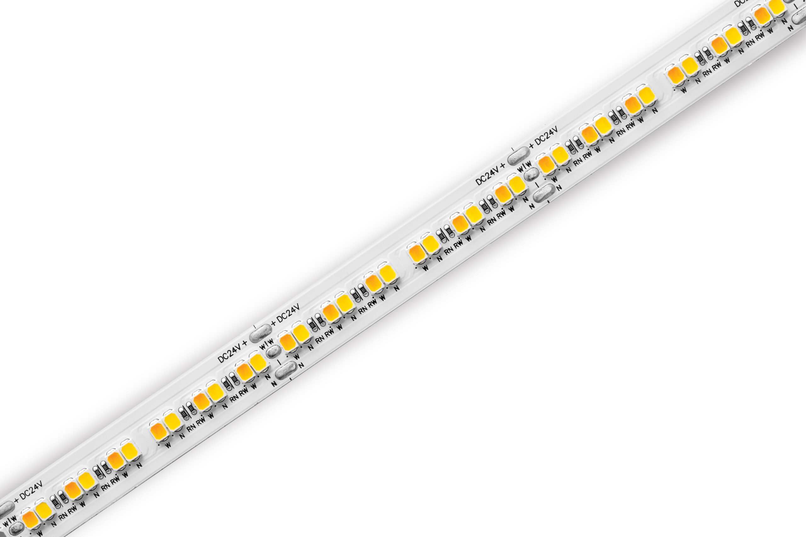 Close-up of a white LED strip light with yellow LED chips and labeled 24V solder pads along its length.