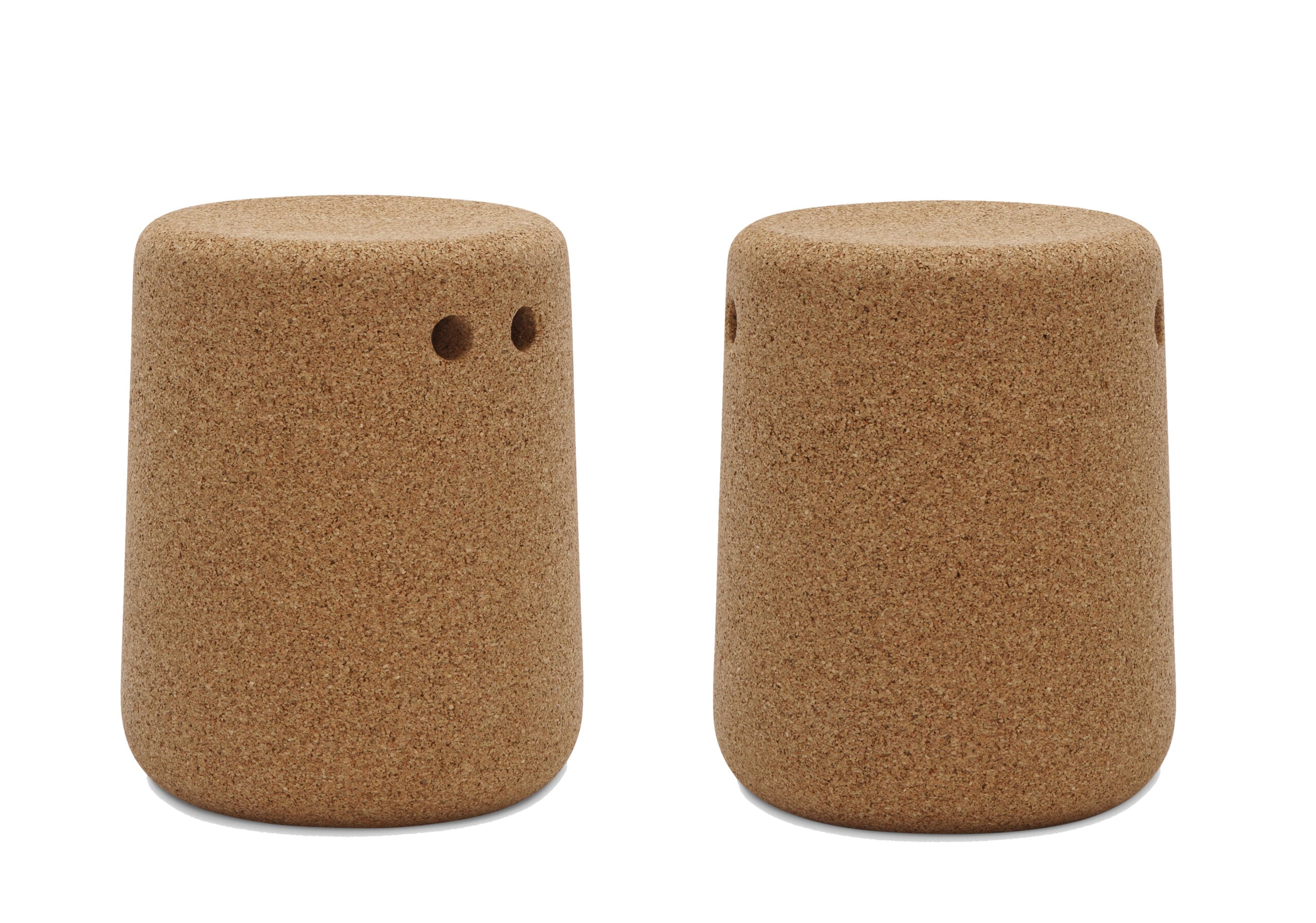 Two cylindrical cork containers, each with small holes near the top, likely designed as salt and pepper shakers. Made of biobased materials.
