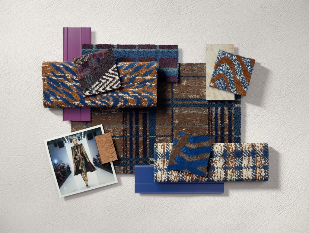A flat lay of patterned fabric swatches, paint chips, and a fashion runway photo arranged on a textured white surface.