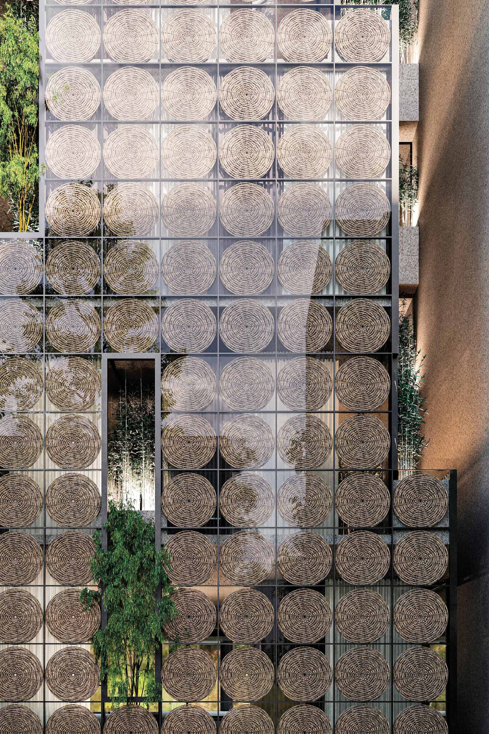 Modern building facade with glass panels decorated by repeating oval lattice patterns; tree and greenery are visible in front and on balconies.