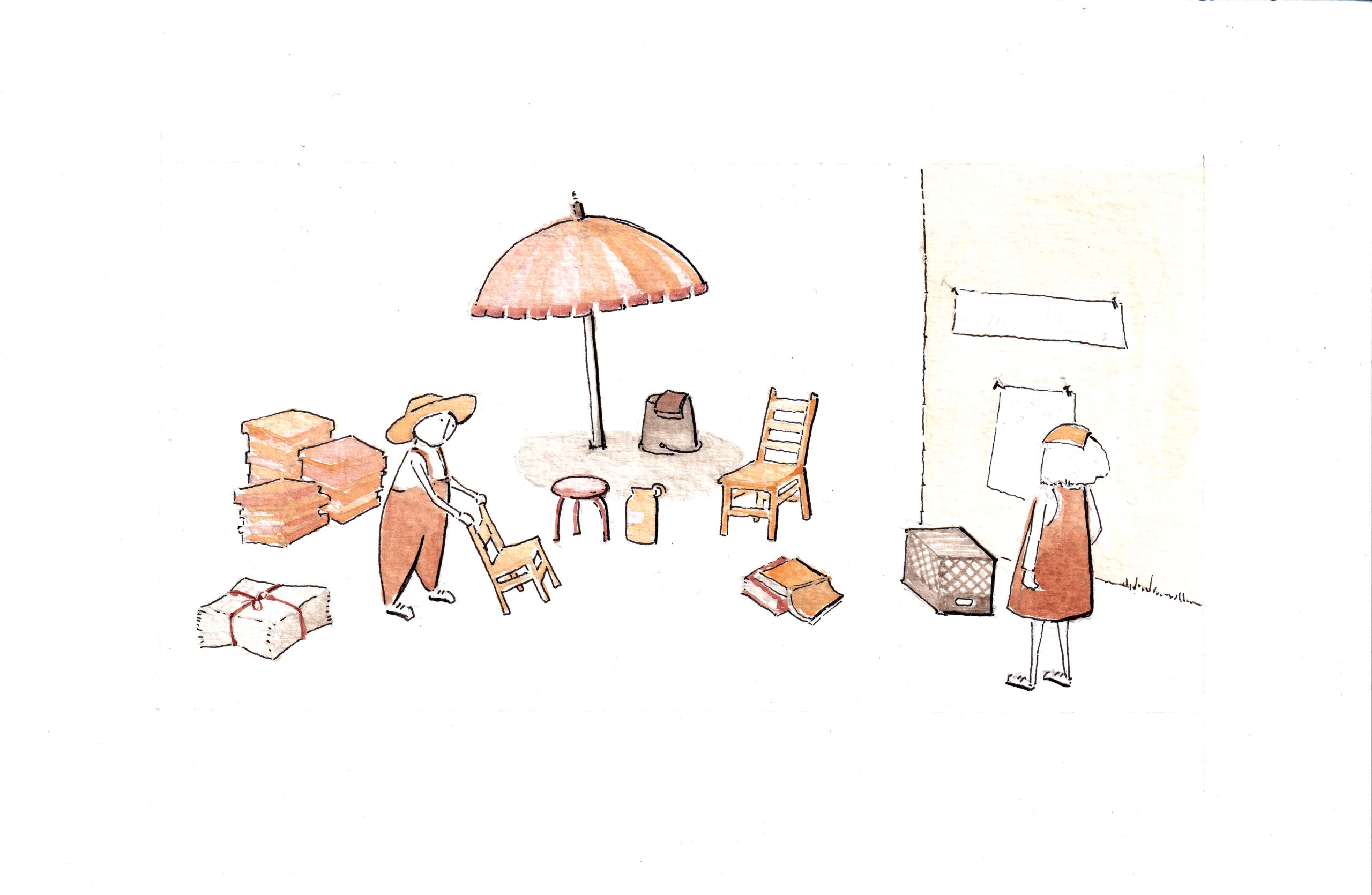 Two people set up chairs, a table, and boxes under a large umbrella outside, with books—including MOS’s New Book On Public Spaces—and crates nearby.