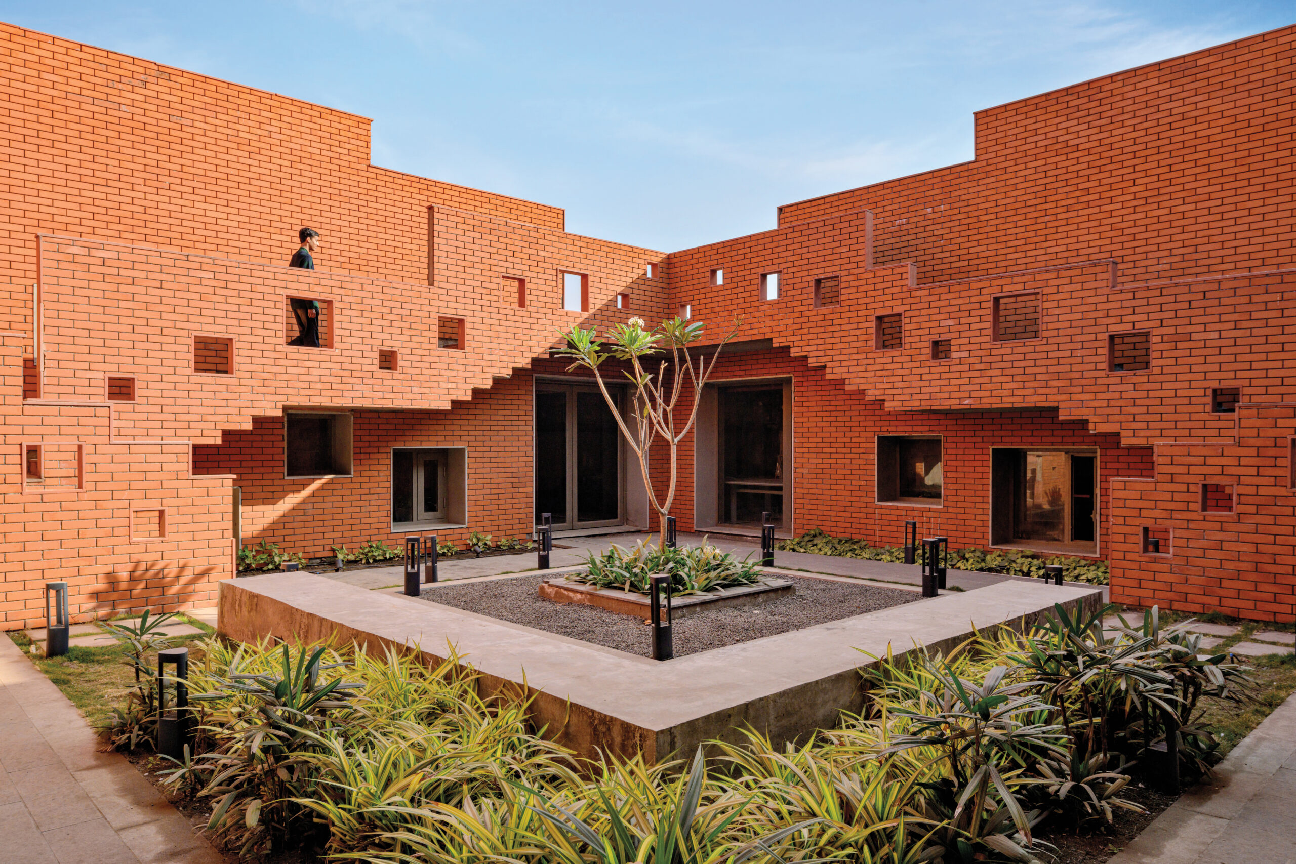 Green, shaded spaces run throughout Prestige University, and many of the courtyards are accessible by wheelchair. 