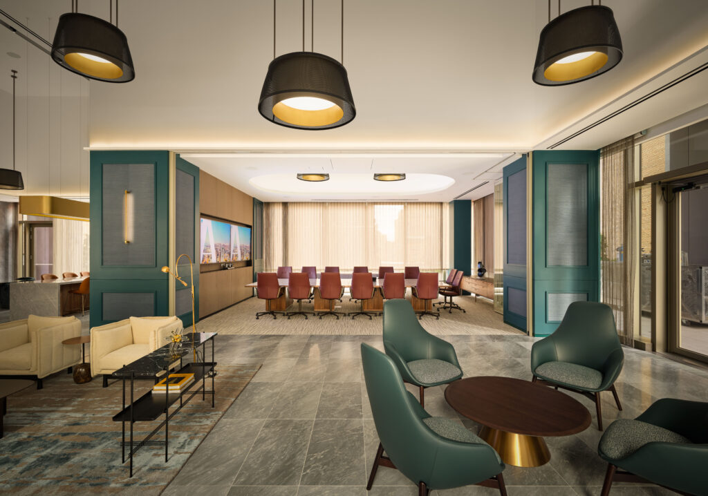 Modern office lounge with green armchairs and a round table, featuring design elements inspired by the Lucas Museum of Narrative Art, and a conference room in the background.