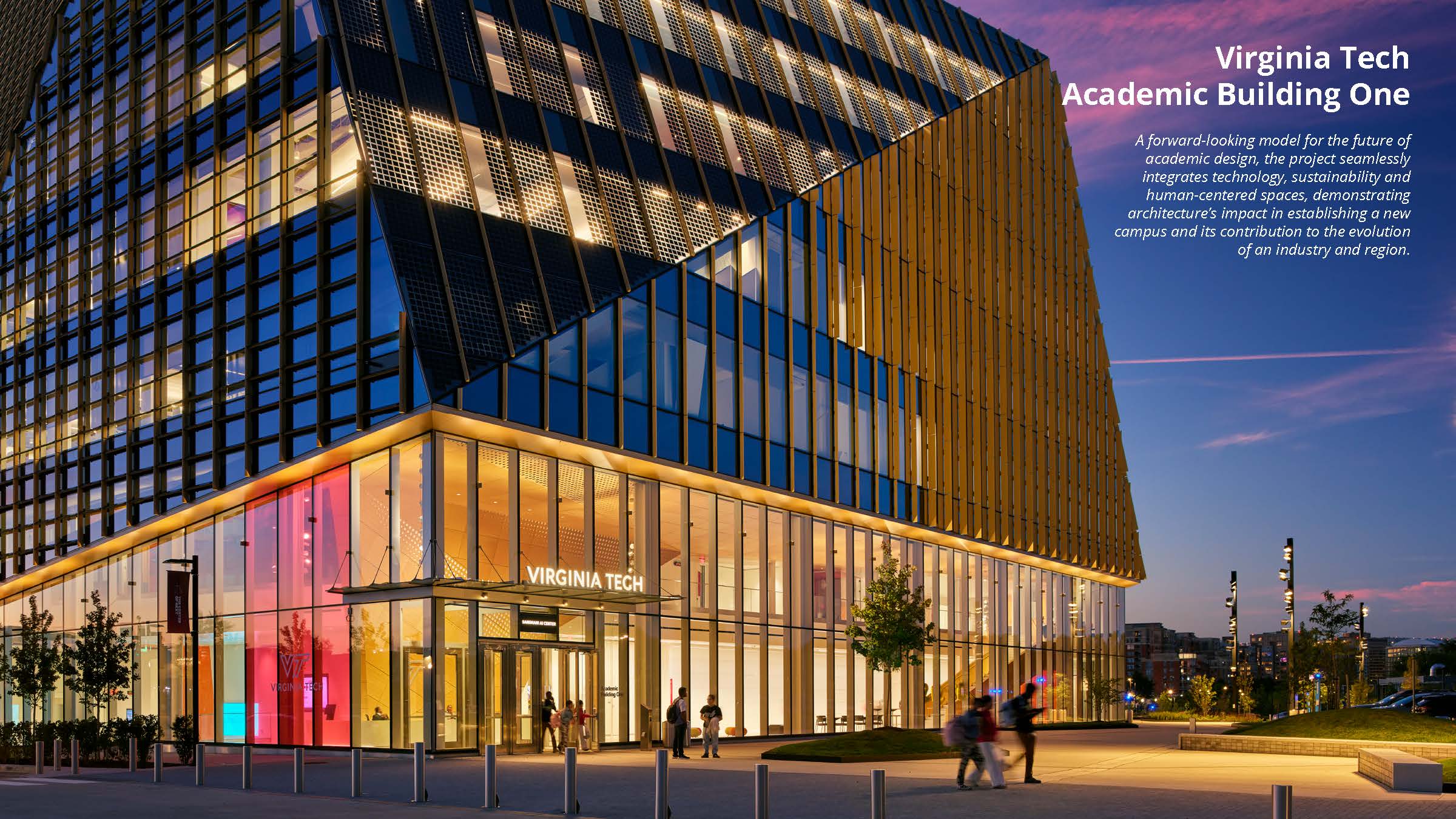Modern glass-fronted Virginia Tech Academic Building One at dusk, illuminated indoors and outdoors, with people walking by and the sky showing evening colors.