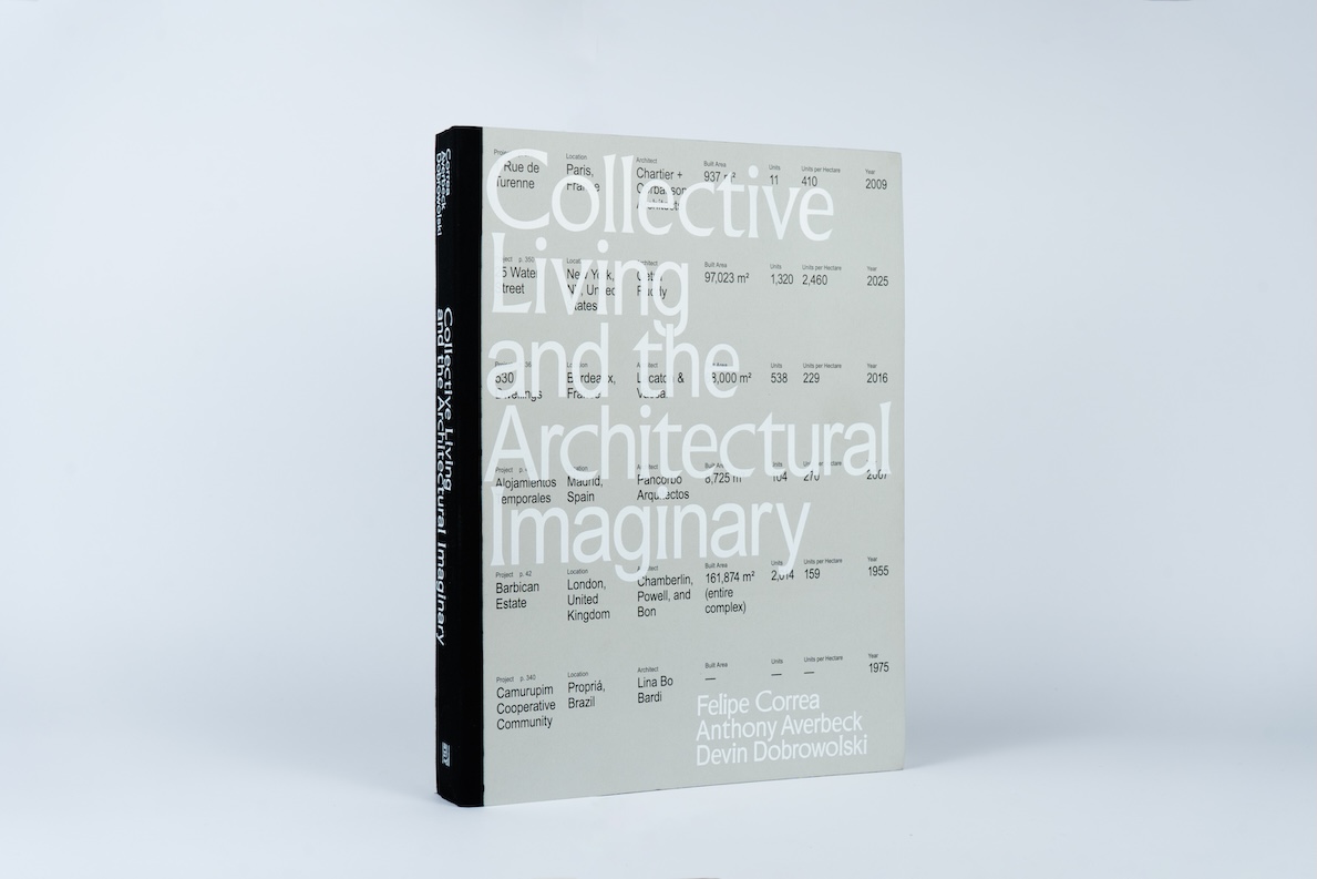 The book “Collective Living and the Architectural Imaginary” stands upright with a minimalist white and gray cover, exploring Architecture’s Kinships through authors Correa, Averbeck, and Dobrowolski.
