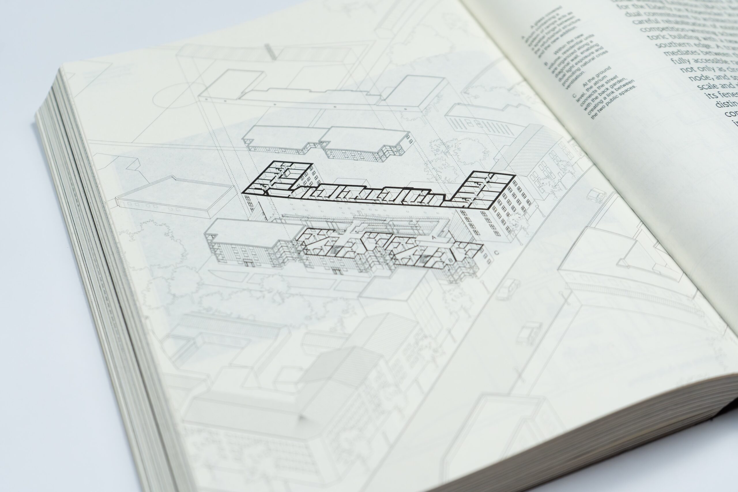 Open book showing a black-and-white architectural drawing, with Architecture’s Kinships highlighted in the building floor plan over a faint site layout.