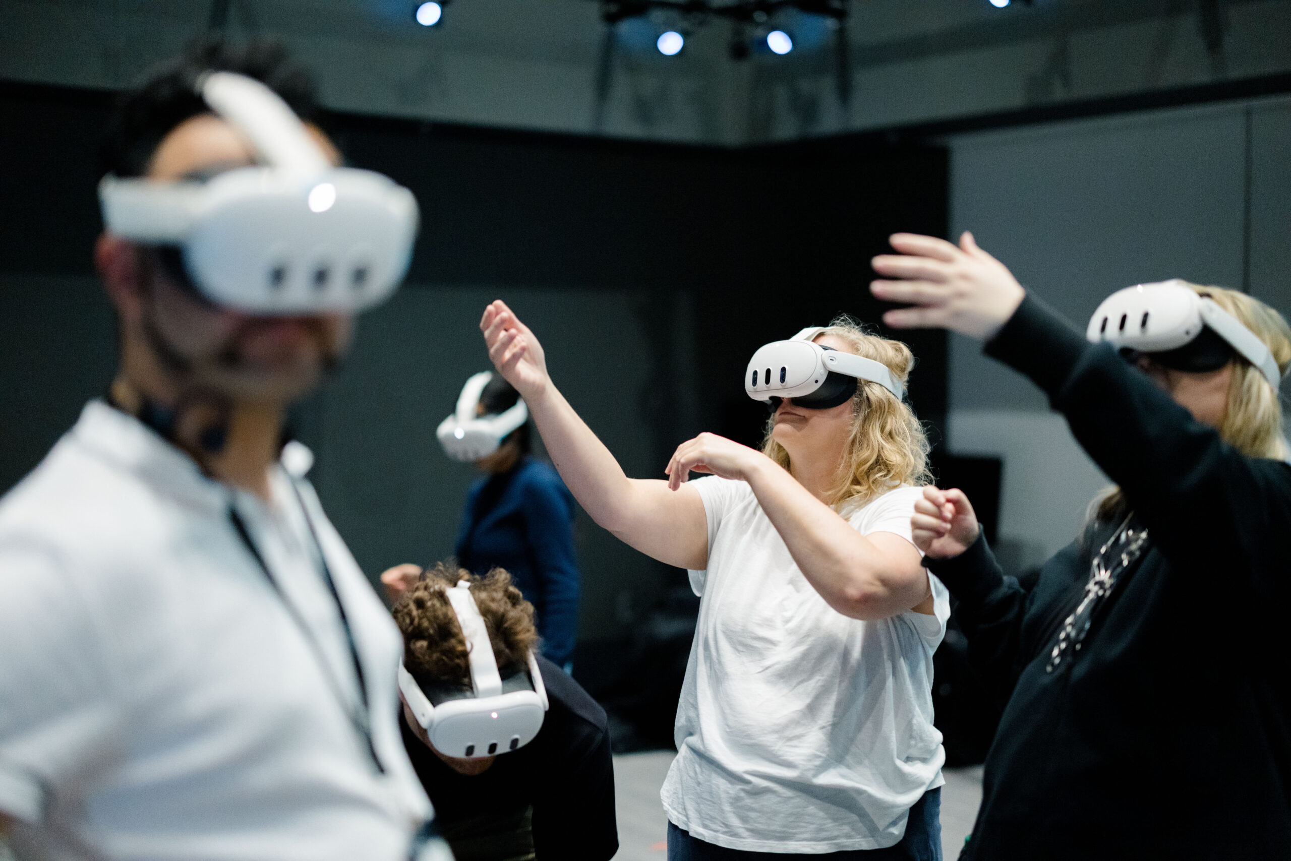 A group of people wearing virtual reality headsets at MIT Future Fest in an indoor space.