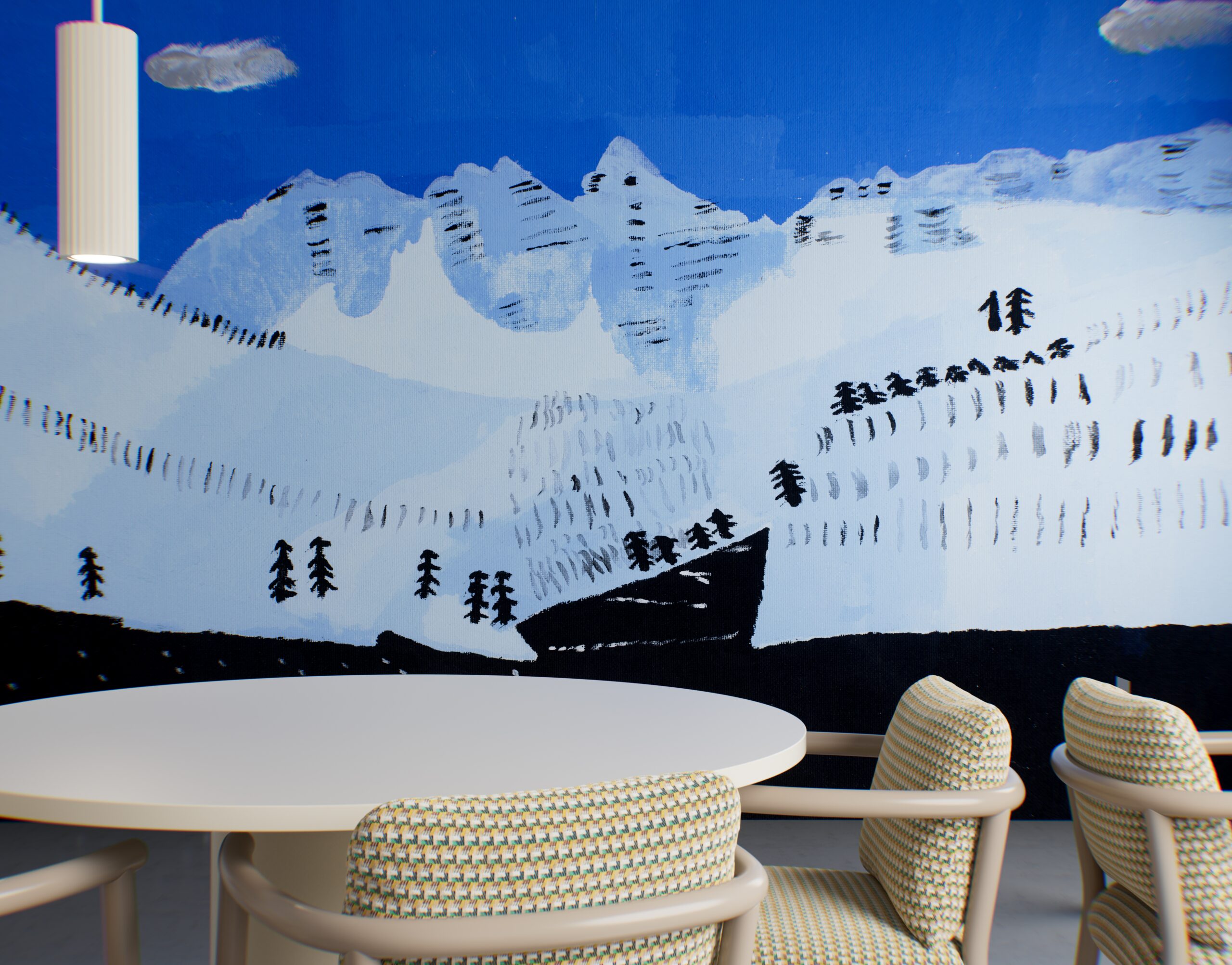 A round white table and patterned chairs set against a wall mural of stylized snow-capped mountains and trees.