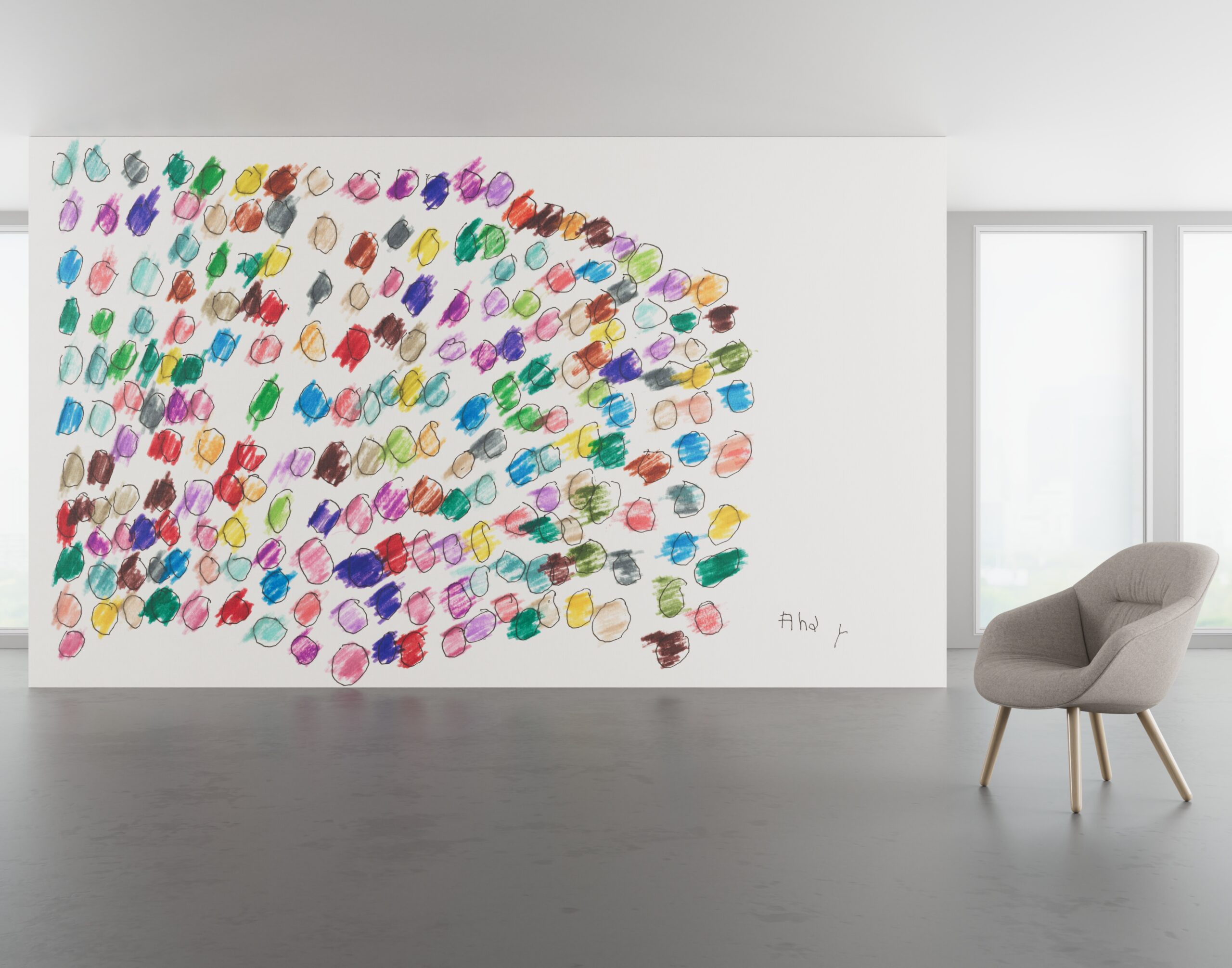 A large wall decorated with many colorful, hand-drawn scribbled circles, with a single grey armchair positioned in front.
